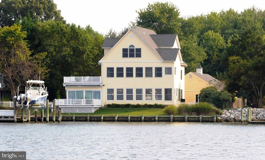 PRICED 150K LESS THE RECENT APPRAISAL!  Spectacular waterfront view of the West & Rhodes Rivers, the Chesp. Bay, & Bay Bridge. Braz. Cherry through out the main & upper lvl.  SS appliances, granite, and endless views of the Bay.  Double buttress sea wall and 3 boats lifts on the pier.  30x40 3 car garage that's heated & has fb and hook ups for a kitchen. 40 min from DC and minutes from Annapolis.