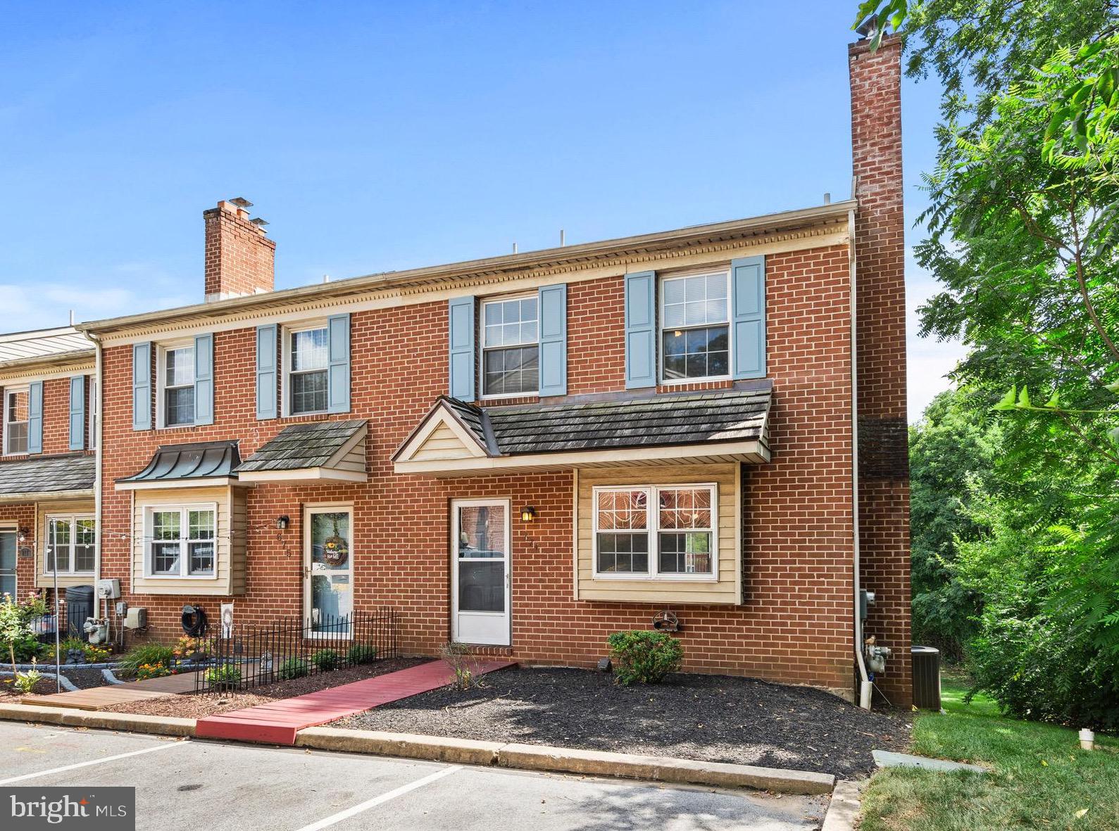 Welcome to your new home in Heritage Manor! Nestled in the highly sought-after Upper Merion School District, this charming end-unit townhome offers the perfect blend of comfort, style and convenience. Step inside to find newer engineered wood floors flowing throughout the main level. The spacious living room, complete with a wood-burning fireplace, creates a cozy spot for relaxing evenings. The dining area—adorned with a ceiling fan—flows seamlessly from the living room into the kitchen. The kitchen boasts an island for extra prep space, stainless steel appliances (including a newer microwave and dishwasher), electric cooking, a pantry and sliding doors leading to an elevated deck (with new wood) and a canopy—perfect for outdoor dining or morning coffee. A powder room is conveniently located on the main level for you and your guests needs.
Upstairs, you’ll find three bedrooms, each with a ceiling fan, and a full bath featuring an extra-deep tub/shower combo, vaulted ceiling and skylight. The primary bedroom offers an extra sink for added accessibility as well. The finished, walkout basement is ideal for entertaining, featuring a built-in dry bar with cabinets and plenty of natural light from sliding glass doors to the outside. A separate storage/laundry room keeps things organized and if you need more storage, the attic has the space. Additional features include two assigned parking spots right out front, wiring for an ADT alarm system and a low monthly fee for easy living within the association. With its unbeatable location, thoughtful updates and spacious layout, this home is ready for you to move right in and start making memories!
