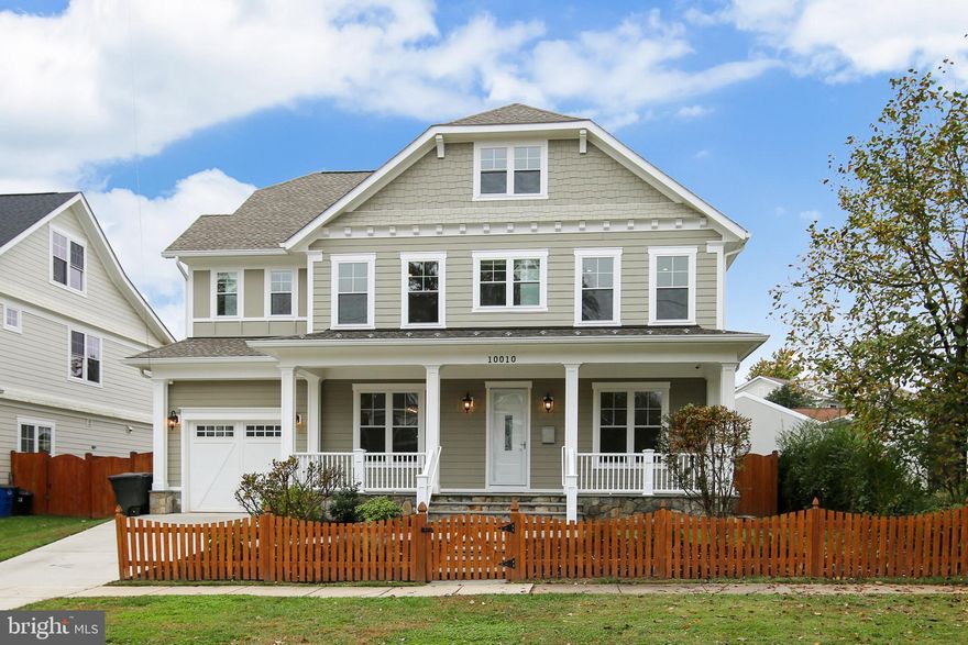 Sleek, clean lines and bright, airy spaces define this 5-year-young Bethesda home with premium lighting fixtures & appliances, and luxurious features in all 5 1/2 baths. Everything in the home is modern and energy efficient thanks to "smart" engineering, and offers unique features such as rounded wall edges, hand-scraped hardwood floors, custom stainless-steel stair railings - to name a few WOW factors! The gleaming kitchen is any chef's dream with an oversized Quartz-topped island, abundant custom cabinetry and sparkling stainless-steel KitchenAid appliances including double wall ovens and a five-burner gas stove. Recessed lights, high ceilings & lighted overhead fans are featured throughout the home, as are commercial-grade vent registers installed in ceilings to prevent dust, dirt and other small particles from entering.  Set in the established, eclectic Marymount community just minutes from shops and I-270, the home offers 5,580+ finished square feet on four finished levels, and includes 6 bedrooms, as well as fabulous contemporary spaces that flow effortlessly from one room to the next. Mature landscaping and a partial picket fence grace the home's facade, while a wide stone path leads up to a large, welcoming front porch also lined with flagstone. Bright white columns and railings contrast nicely with the light gray HardiPlank exterior.  MAIN LEVEL:  Behind the storm and custom front doors, wide planks of hardwoods line the floors throughout the main and upper levels. Ten-foot ceilings, ample windows and invisible columns & ductwork create clean, uncluttered spaces, starting with the study to foyer's right with French doors and front & side windows. The dining room across the hall has a double front window, recessed lights and a crystal chandelier. A Porcelanosa-surround gas fireplace with a wall-mounted TV above, flanked by high-placed windows highlight the fantastic family room that also features a large picture window unit, offering lots of natural light and a great view of the fenced backyard with lush lawn, a stone patio and a charming playhouse. The playhouse features a cathedral ceiling with a pair of skylights! The family room opens into the spacious kitchen, sunny with a French door off the breakfast room and above-the-sink window. The sparkling stainless-steel KitchenAid appliances include double wall ovens and dishwasher; the refrigerator is LG. The oversized island has a vegetable sink, and a wall of custom cabinets provide generous pantry space. Italian tiles line the kitchen floor. There's a butler's pantry with a wine cooler and more cabinets between the kitchen and dining room. The powder room boasts marble flooring and a custom vanity. Marble tiles also line an accent wall.  A mudroom with a walk-in closet with lots of coat hooks is off the kitchen area, as is access to the attached single garage. SECOND LEVEL: The owner's suite has a double-door entry, a tray ceiling with recessed lights and a lighted ceiling fan. A pair of side windows and a rear triple window offer lots of daylight, while spacious his/hers walk-in closets have pocket doors. The owner's bath is luxurious and reflects the simple, clean lines seen throughout the home, and includes his/hers custom vanities, a stand-alone tub and a large glass-enclosed shower with built-in bench and duo shower heads. There's a generous linen closet. All baths feature water-saving Toto toilets. The other bedrooms have generous windows and closet space. Bedrooms 2 & 3 share a buddy bath with a double vanity and tub/shower combination. Bedroom 3 also has a walk-in closet and a trio of windows overlooking the front. Bedroom 4 has a walk-in closet, a pair of front windows and an en-suite marble bath that features a double front window and a tub/shower combo with a rain showerhead. The laundry room is on this floor, and has ceramic tiled flooring, LG front-loading washer/dryer, a sink and cabinets.