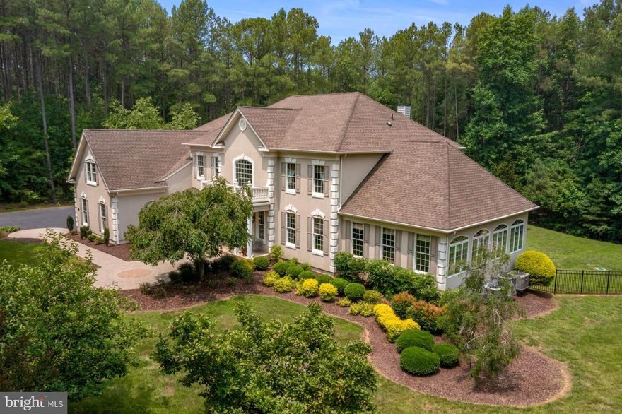 This is WHERE you'll find the best of both worlds, a luxurious and private estate just shy of 3 acres, near all the charm and allure of Downtown Fredericksburg. This stunning home, surrounded by expertly manicured landscaping, leaves a lasting impression the moment you enter. Once inside, an 19 ft marble foyer, accented with coffered ceilings, leads to a grand double staircase, with glimpses of finely crafted details found around every turn. Highlights of this 4 BR, 4.5 BA oasis include bright sun-kissed rooms, a newly carpeted solarium lined with walls of windows, an airy open floor plan designed to captivate from room to room, decorative columns and moldings, hardwoods, Bose speaker system plays your favorite sounds throughout, including the outside when entertaining by the pool. For an added touch, the property is also equipped with an invisible fence for any beloved furry friends, thoughtfully finished with a 3-car side-entry garage. A gourmet kitchen all Chef’s can admire, complete with high-end appliances, gas range, double wall ovens, enhanced with artisanal cabinetry, and walk-in pantry fit for every family and friend’s special occasions, accompanied by an oversized granite island with bay window views and French door access to the magnificent woodlands that encompass the upgraded Mineral Springs saltwater pool. The heated swimming pool is made of reinforced concrete with Pebble Tec finish, and an upgraded Caretaker integrated self-cleaning system. Back inside, you’ll find a Study, Mud Room, and adjacent Laundry Room all with custom built-ins on the main floor. On each side of the foyer, an intimate sitting room and elegant formal dining room with tray ceiling awaits. The beautiful family room has a gas fireplace. Upstairs is the soothing primary suite with large walk-in closet. The en suite bath feels more like a spa retreat with decadent soaking tub, tranquil chandelier, dual sink vanity, and glass-enclosed shower. Let your imagination soar, beyond the en suite bath, MORE is more, a bonus room with two walk-in closets.
Down the hall, three serene and spacious junior suites, each possess a private bath. The sprawling unfinished walk-out lower level is master plumbed and has 9ft ceilings, potential for two more bedrooms, ample storage, integrated French drain system surrounding the house, and an additional 3,300 square feet that is simply waiting for your personal touch — owners invested close to $200K perfecting the exterior of the home. Added features, 3 zone HVAC system, water treatment system, sprinkler system around perimeter of home. All this and more completing the luxury and distinct comfort of this destination home. Miles away from the City’s hustle and bustle yet uniquely accessible to life’s greatest pleasures and activities, historical sites, wineries, dining, entertainment, and shopping. Offering commuter’s close proximity to I-95, Route 1, and the VRE. This extraordinary home & lifestyle can be yours!