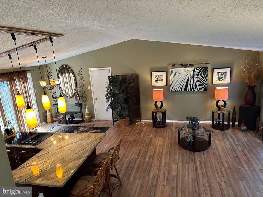 The house has had many improvements over the years. Allow me to tell you about the most significant changes that have elevated this home significantly over other houses in the neighborhood. 

Gourmet kitchen. Completely refurbished approximately 6 years ago. Two walls were removed and the foot print of the kitchen was enlarged. “L” shaped island was installed with a modern cooktop (4 burners and a warmer). This is a downdraft unit. Beautiful wooden high end cabinets were installed. These are much larger and much higher quality than the original particle board cabinets. All cabinets and drawers are soft closing. Convenient sponge/brush storage is built in to front of sink. All cabinets have quality slide outs where appropriate. A built in spice cabinet is to the left of the chef. All pots, pans, utensils, are easily accessible without walking. A double lazy Susan also has most cooking supplies conveniently located. There is a double pull out shelf arrangement to the right of the wall oven so there is no dead space in the corner. Storage is maximized. This is a super efficient layout for the chef. There is also a double trash can cabinet, Bosch dishwasher, and self cleaning oven. New circuit was added to double the number of other appliances you may use at once without blowing breakers. All under cabinet lights are LED and may be dimmed individually or turned on and off individually or collectively with a wall switch. There are 17 modern lights installed to illuminate the kitchen. No working in the dark.

A whole house fan is installed right outside the master bedroom. This fan does an amazing job of drawing in fresh air for whatever window you choose. When used properly, it can cool off the entire house quickly saving much on electric bills.

Asphalt driveway has been replaced with more trouble free cement.

An access door was installed in the back wall of the garage and a cement pad added for proper storage and easy access of trash cans.

All bathrooms have been tremendously upgraded to ceramic tile and high end amenities.
There is space in the family room that allows for easy conversion to either a fourth bedroom or a private office.

All new flooring throughout.

Garage has been finished off.

New paint inside and out.

Fantastic location close to I 95, shopping, and restaurants.

High quality double hung energy efficient windows have been upgraded for most windows. Both top and bottom windows tilt in for easy cleaning.

There is an easily removable doggy door and a 6 foot privacy fence for the fur babies.

Cathedral ceilings on the main floor. The other ceilings are less than the standard 8-10 foot ceilings. This greatly decreases the number of cubic feet needed to be heated or air conditioned. This home is very energy efficient.