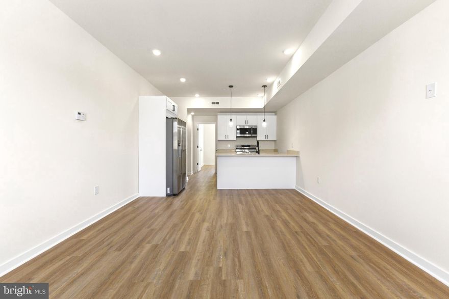 Experience modern city living in this amazing, brand new bi-level apartment featuring 3 oversized bedrooms, 3 full bathrooms, and your very own private rooftop deck. The main level welcomes you with a sunlit open-concept living room and kitchen, highlighted by high ceilings, vinyl plank flooring, quartz countertops, sleek cabinetry, and stainless steel appliances. Just off the living area is a generously sized bedroom with its own full bathroom—thoughtfully placed to offer both comfort and privacy. Upstairs, you'll find two more spacious bedrooms, both large enough to fit king-size beds. One of the bedrooms includes a private full bath, while the third bathroom is located in the hallway for easy access. Take one more set of stairs to your private rooftop deck—a perfect outdoor extension of your living space. With bright rooms, a smart layout, and high-quality finishes throughout, this one-of-a-kind apartment is not to be missed—schedule your showing before it’s gone.