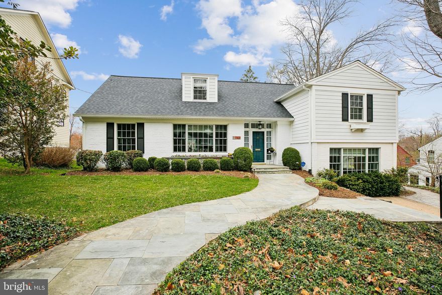 Experience the perfect blend of classic Chevy Chase charm in this meticulously maintained 4-level, 3-bedroom, split-level gem, nestled on a tranquil street in Ridgewood Village. The home's flagstone walkway sets the stage for a stunningly spacious main level, where rich hardwood floors, elegant crown molding, and a cozy brick fireplace create an atmosphere of sophisticated comfort. The heart of the home features a beautiful wainscoted picture-window wall, thoughtfully designed to provide a seamless visual and social flow between the living and family rooms. The adjacent dining area is flanked by a large picture window, perfect for sun-drenched morning meals, while the eat-in, island kitchen features stainless steel appliances, a breakfast nook, and room for a rolling island.
Upstairs, hardwood floors extend through the two generously sized bedrooms on the first upper level, and through the spacious primary suite on the top floor.  The primary en-suite bathroom features an elegant brick-and-tile theme, providing a comforting retreat.
Transition effortlessly to outdoor living through the family room’s elegant French doors, which open onto an expansive rear deck. Surrounded by lush greenery, this private outdoor oasis is ideal for al fresco dining or peaceful relaxation. The location is unbeatable, just two blocks from the scenic walking and biking trails of Rock Creek Park, minutes from two Metro stations for an easy commute, and a short drive from the world-class dining, shopping, and entertainment of downtown Bethesda.