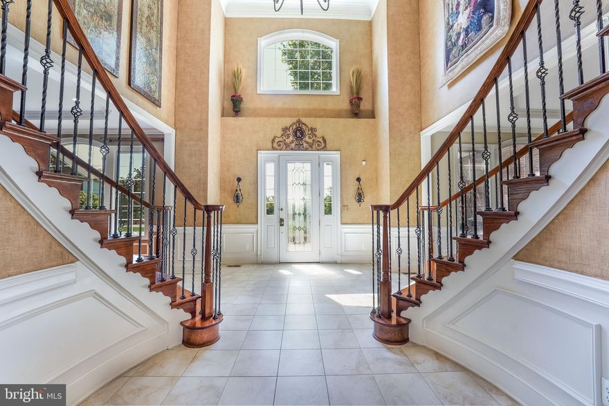 YOU HAVE FOUND IT. This IMMACULATE Toll Brothers custom home is located within the prestigious gated community of Belmont Country Clubwith nearly 9,000 sq ft of finished living space and has all the upgrades; including gourmet chef's kitchen, GE Monogram appliances, double ovens, two dishwashers, a large two-tiered granite island, and a huge walk-in pantry. Just off the custom kitchen sits the Naples sunroom which overlooks an expansive and lush backyard complete with a three-tiered water fountain and a large stone fireplace. The surrounding stone paver patio is large enough to host very large events with friends and family or simply melt away with the rushing sounds of water and countless species of birds. The backyard also has several large raised garden beds for those that like to grow fruits and vegetables. The main level has twelve-foot ceilings throughout, a 3 car garage, ample driveway parking for up to +10 vehicles, and a wrap-around paver walkway leading to the front entrance with another large patio complete with stone sitting walls. The Conservatory has an impressive built-in stone bar that is an entertainer's dream and a great place to catch the games on the two wall-mounted flat-panel TVs. Built-in cabinets, granite countertops, and two beverage centers and room for a built-in ice machine. The finished basement could be its own home within the home hosting a large gym, enormous Black Diamond projection screen, full kitchen, full bath, additional half-bath, large bedroom, and sitting area. This level is perfect for an in-law or au pair suite or its own apartment. The home is surrounded by custom landscaping, lighting and an in-ground sprinkler system. Additional features unique to this model are a Bonus room off the master bath (office), a bonus room in the attic (office), and another bonus room above the family room that can easily convert to another bedroom, theater or home office. Located in the heart of Loudoun county in a very quiet neighborhood with amazing neighbors and no traffic. The community is next to the Belmont Chase marketplace with great restaurants, grocery and coffee shops and is minutes to One Loudoun Center, Dulles Town Center Mall, and Dulles International Airport.