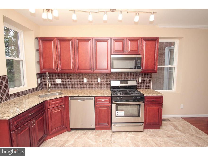 Unbelievable newly renovated home, very conveniently located! The entire home has been newly rehabbed top to bottom. Do you like elegance? Well this home is one of a kind and offers every extra a buyer could desire. All of the windows have been replaced, and there is a new roof w/ warranty, all new siding, updated electrical & plumbing, and not to mention new energy efficient Heating & AC Units! The 1st floor features a huge open layout with hardwood floors, recessed lighting, a new kitchen, which features granite counter tops, and stainless steel appliances. The upstairs features three sizable bedrooms, and a state of the art spa bath w/ custom Italian Ceramic tile. There are two additional half baths. This home truly has it ALL and is a MUST SEE!