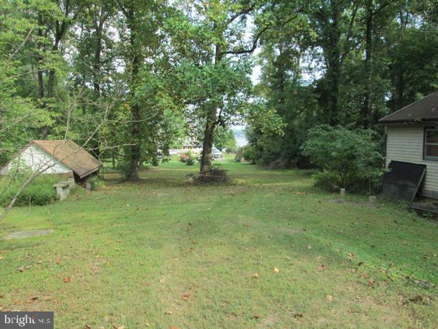 Almost a 2 acre lot with river views. Cabin on site is in rough condition. Build your vacation home or dream residence.