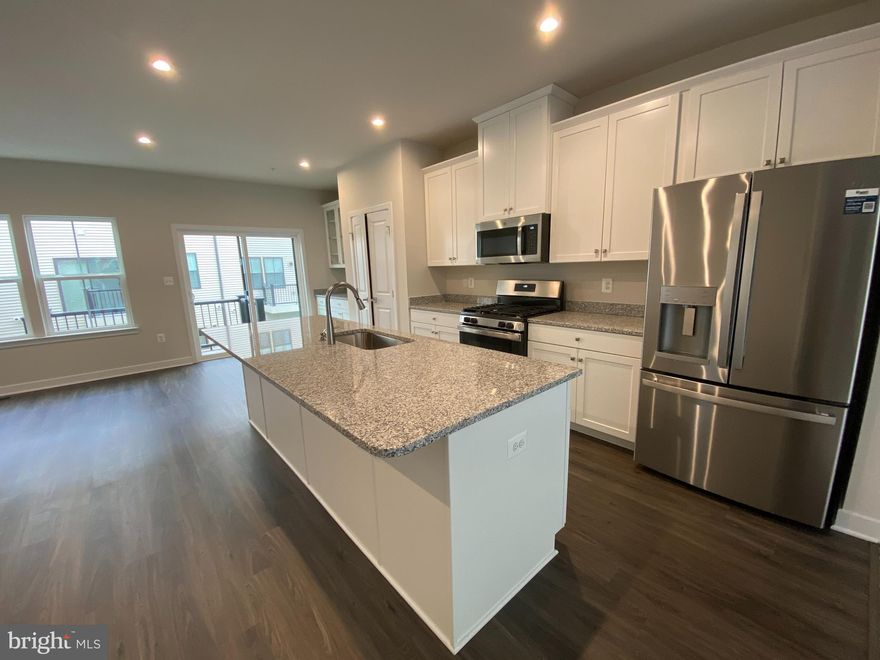 What a beauty, your search stops here! This is a new construction with 4 stunning, spacious levels. The home has an open concept floor plan with a gourmet kitchen and a ROOFTOP DECK to boot! The Primary Suite on the 3rd Floor features a soaking tub, separate shower and a nice size walk-in closet. Two-car garage, great community short walk to Metro. Welcome home!