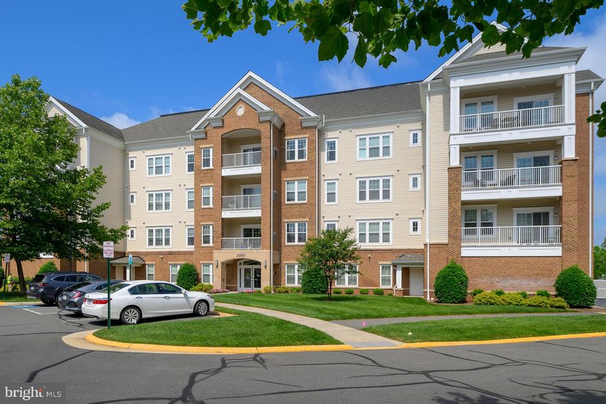 Enjoy this amazing 2 bedroom/2 bath TOP FLOOR PENTHOUSE UNIT with a spectacular view of the community! This unit was originally a PULTE model home with over $49K in options and upgrades. Kitchen features top-of-the-line SS appliances, high end cabinets, backsplash and upgraded granite. Bathrooms are beautiful with star studded fixtures, upgraded granite and custom tile flooring. Hickory hardwood floors in foyer, kitchen, dining room and great room. New carpet and recently painted to sell, this Penthouse suite is probably the best in the neighborhood. It also comes with the rare, ONE CAR GARAGE plus EXTRA STORAGE. 55+ Community features gated entrance, clubhouse with indoor pool, fitness center, ballroom, lounge, billiards and game rooms, arts and crafts room, indoor running track. Are you ready to live the good life in a rare to the market "Penthouse in Potomac Green community".