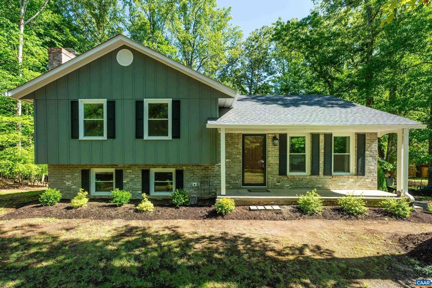 Beautifully updated split-level home in the desirable Terrybrook neighborhood, conveniently located just minutes from Hollymead Town Center and NGIC. Tucked away on a quiet cul-de-sac and elevated above the road, this inviting property offers excellent curb appeal with a freshly painted exterior and welcoming front porch. Extensively renovated throughout, this move-in-ready home features a new roof, new windows, brand-new kitchen, and comprehensive interior updates. The main level offers a spacious living room and easy access to the new rear deck overlooking the private backyard. All 3 bedrooms are located upstairs, including a primary suite with private bath. The walkout lower level features a large family room with cozy wood-burning fireplace, an additional full bathroom, and laundry room complete with new washer and dryer. Additional improvements include extensive tree work and landscaping to open up the yard, plus a recently serviced septic system with a new distribution box installed and a clean bill of health. Set on a peaceful 1-acre lot in a sought-after Albemarle County neighborhood, this turnkey property offers privacy, convenience, and modern updates throughout.,Granite Counter,White Cabinets,Fireplace in Basement