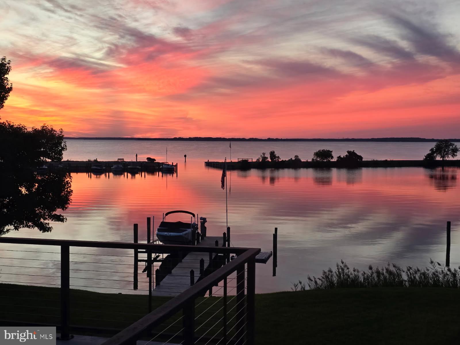 You are going to Love the Amazing Sunsets and Broad Water Views from this waterfront home located on the protected Marina in Prospect Bay. Fabulous floor plan. Kitchen connected to large family room with floor to ceiling stone fire place. Spacious separate dining room. Exercise room could be the flexible space you seek. A 2nd family room with electric fire place opens to the waterside wrap around deck. The Primary bedroom is filled with water views and has a full bath with soaking tub, walk in shower, dual sinks plus a walk in closet. The 4th bedroom provides more flexible space and has gorgeous water views too. The second level deck is the perfect place to gather and watch the world go by. Irrigation system, Oversized garage, Large parking pad, shed and of course Pier with a new lift! Perfect! Residents of Prospect Bay enjoy many amenities including: Golf Course, Restaurant, Club House, Swimming Pool, Boat Ramp, Tennis Cts, Pickle Ball and more.