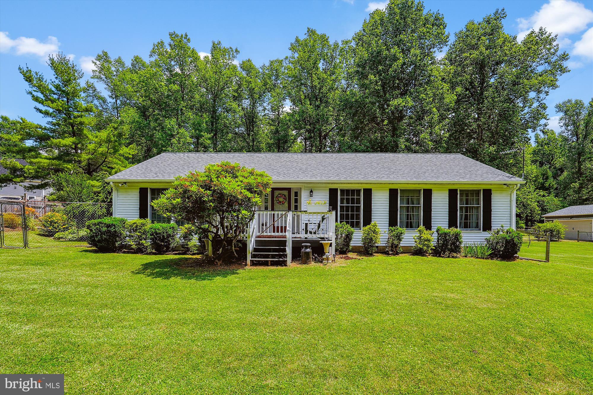Close to Route 7/Bluemont, VA, for easy commuting with low WV taxes! One-level living on a gorgeous 1.17-acre lot in Skyline Orchards development with a 7.5-acre community area, including a 2-acre recreational lake. New roof (house, screened porch, and garage) and vinyl siding (house). This updated 3-BR/2-BA home is fully fenced and has a beautifully landscaped private garden. The large screened-in porch and attached wrap-around deck are great for outside entertaining or a quiet place for morning coffee or evening cocktails. The detached oversized 2-car garage (24x32 ft) includes a workshop (sub-panel and a 50 Amp outlet) and an attached lean-to on the back of the garage for additional storage. New (2023/2024) roof, gutters/downspouts on house and garage. New (2023/2024) vinyl siding on the fence and fresh paint on the garage. Fenced-in raised bed garden and a concrete patio for outside dining. Two frost-free hydrants (one near the garage and one in the garden) and the 2 hose bibs on the house make water accessible over the entire property. Minutes to Bear Chase Brewery, the Appalachian Trail, Bear's Den Scenic Lookout, and all the other nearby amenities make this a great place to live. The HOA is responsible for maintaining the roads within the development and snow removal.