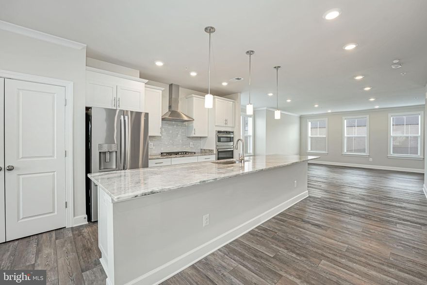 **Potential VA loan assumption**

Welcome to your dream home! This exquisite end-unit townhome offers modern luxury and unparalleled convenience. Built just 2 years ago, it boasts 3 spacious bedrooms and 2.5 sleek bathrooms. The elegant interior features luxurious vinyl flooring throughout and an upgraded kitchen with sleek countertops, perfect for cooking and entertaining. Both full bathrooms are equipped with double sinks allowing plentiful space for residents to get ready for the day. Enjoy the ease of in-unit laundry and the added convenience of an attached garage, with EV plug in available. Situated close to a variety of restaurants and local attractions, this home ensures you're never far from vibrant community life. Don't miss the opportunity to experience luxury living in a prime location. Schedule your tour today!