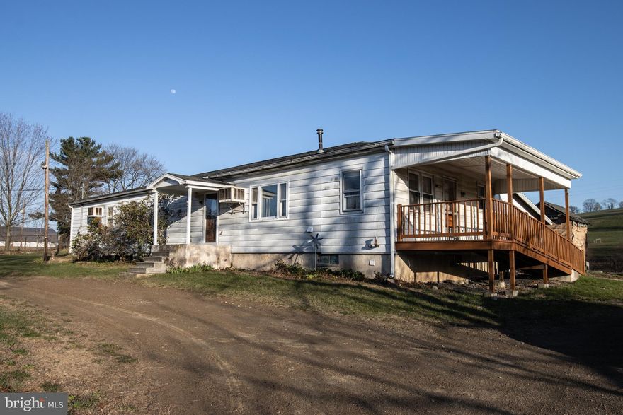 Nestled in the serene countryside, this charming one-story home offers the ideal opportunity for those seeking a peaceful retreat in the highly sought-after Blue Mountain School District. With one-floor living, this home is perfect for anyone who prefers a layout that eliminates the need for stairs, providing ease and convenience for everyday living. Accessibility is further enhanced by ramp access, ensuring ease of entry for all. The property boasts breathtaking views of the surrounding countryside, where you can enjoy beautiful views whether you're sipping coffee on the porch or relaxing indoors, the tranquil atmosphere and beautiful views create a perfect backdrop for unwinding and appreciating the natural beauty of the area. Although this home is being sold "as is", it holds immense potential for buyers who are looking to invest in a property they can make their own. While some updates and repairs are needed, this presents a unique opportunity for the right buyer to customize the space and create their ideal country home. The property offers country living at an unbeatable price, giving you the chance to enjoy the best of both worlds—a peaceful, rural lifestyle with close proximity to local amenities. This property provides the perfect canvas to turn your vision into reality. Don’t miss out on this rare find, schedule a showing today!