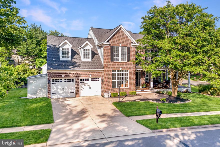 Introducing a magnificent brick-front home nestled on a beautifully landscaped corner lot in the esteemed Broadlands community. This exquisite residence boasts a deep, wrap-around front porch with Trex decking, wide columns, and ceiling fans, all complemented by a durable metal roof. The home's exceptional curb appeal features meticulous landscaping and charming details that invite you in, further enhanced by a screened porch and a deck at the back, offering perfect spaces for outdoor relaxation. Every detail of this home has been carefully maintained and updated with modern upgrades and finishes, making it a standout property in a highly sought-after neighborhood.
<br><br>
Step inside to a grand two-story foyer that sets an elegant tone. Engineered hardwood floors flow seamlessly across the main level, reflecting natural light from numerous windows adorned with custom window shades and recessed lighting. A double staircase adds sophistication and functionality. The main floor features defined living and dining rooms, each with modern light fixtures enhancing the ambiance. The heart of the home is the gourmet kitchen, completely redesigned with a large center island, white quartz countertops, and a subway tile backsplash. It boasts dimming cabinet lights, ample storage and prep space, high-end stainless-steel appliances, a farmhouse sink, and upgraded modern light fixtures. Adjacent to the kitchen is a family room with a vaulted ceiling and a striking floor-to-ceiling stone fireplace, creating a warm and inviting atmosphere. A back staircase from the family room provides easy access to the bedroom level. The main level also includes a private home office with custom built-ins and a convenient laundry room.
<br><br>
On the upper level, elegance continues with engineered hardwood floors throughout the bedrooms. The primary suite is a luxurious retreat with a cathedral ceiling, creating a sense of space and tranquility. The suite's bathroom is a spa-like haven, featuring shaker cabinets, a double vanity, a jetted corner tub, a frameless glass shower, and a skylight. Each detail has been carefully chosen for a serene and indulgent atmosphere. The three spacious secondary bedrooms offer ample closet space and large windows, ensuring plenty of natural light. The upgraded hall bathroom is both functional and stylish with modern fixtures and finishes.
<br><br>
The fully finished walk-up basement is an entertainer's dream, thoughtfully renovated with luxury vinyl flooring for various activities. The convenient kitchenette with a full-size refrigerator, sink, and butcher block counters is ideal for hosting gatherings or casual movie nights. The versatile den offers flex space as a guest room, media room, or home gym. A full bathroom completes this space, making it a self-contained living area.
<br><br>
The attention to detail extends to the two-car garage, transformed with flake epoxy flooring and flow wall panels for a clean and organized look. Wall-to-wall storage features keep the space tidy and efficient. An exterior shed offers custom-built storage for outdoor equipment and tools. The property includes a meticulously designed lot with a 7-zone irrigation system, ensuring lush and vibrant landscaping with minimal effort. With most major systems recently updated, this home is move-in ready, allowing immediate enjoyment of its luxurious and comfortable lifestyle.
<br><br>
Broadlands is a highly sought-after, award-winning community with exceptional amenities. Residents have access to community common areas, playgrounds, nature trails, three swimming pools, nine tennis courts, and 23 tot lots. With over 3 million square feet of shopping, restaurants, services, and offices nearby at Broadlands Village Center and Broadlands Market Place, convenience and entertainment are always within reach. This home offers the best of both elegance and practicality in one of the most desirable neighborhoods.