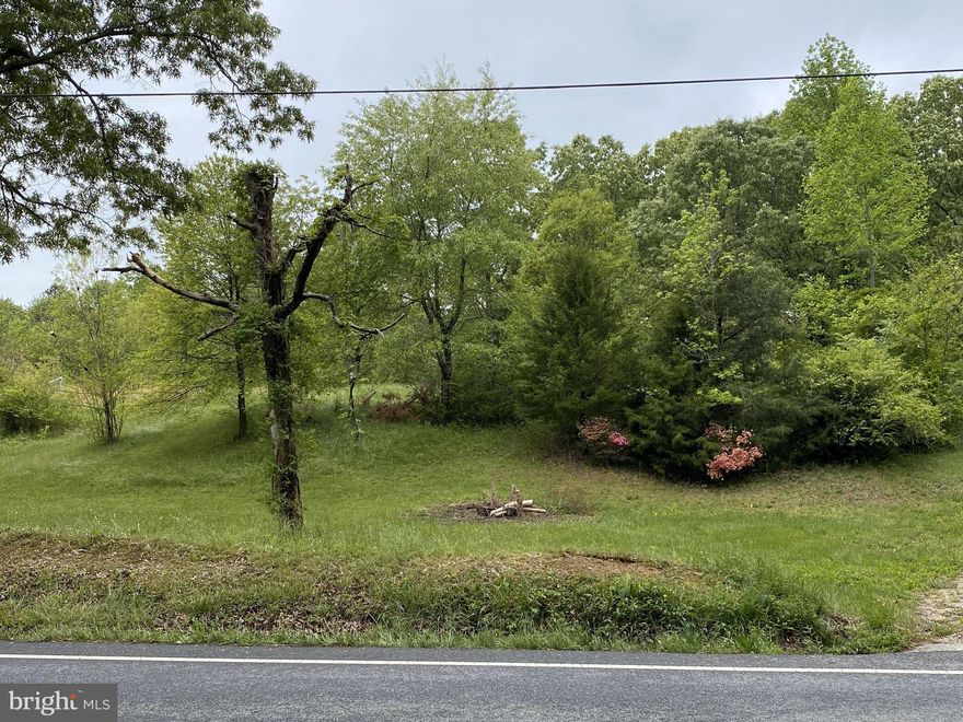 Wonderful 2 acre property to own and build on in the future. Gentle rolling hill with level area in front. Shared driveway. Old well was abandoned. Owner had old house removed. Now is the time to start the process and have your dream home. Old trailer at back of property is "as is"