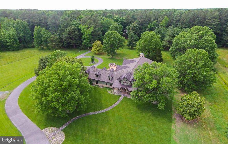 This one of a kind 219 Acre Shore Estate is truly designed with its attention to detail and located within minutes from the Atlantic Ocean and the Chesapeake Bay.  Conveniently located to the Salisbury Airport.  There's over 7500 sq. ft. plus a 4500 sq.ft. walk out finished basement. This home features two bedrooms on the first floor and two bedrooms on the second floor plus a bonus room with a closet, five bathrooms and two half baths.  Gourmet kitchen, three fireplaces and GEO Thermal Heat.  Basement -level features movie room and even an archery practice range!  Two walk-in safes and bullet-proof glass gun showcases.  There's a stocked pond with feeder and this is truly a hunters paradise.