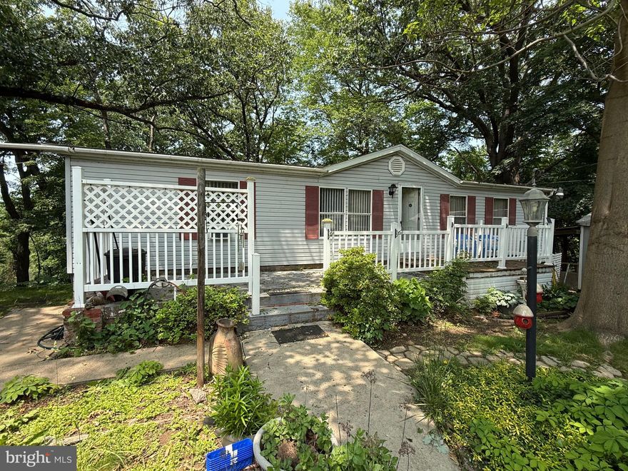 1996 DOUBLEWIDE W 3 BEDROOMS, 2 FULL BATHS ON CHARMINGLY LANDSCAPED .79/ACRE LOT. MAINTENANCE FREE EXTERIOR OFFERS VINYL SIDING, SHINGLE ROOF, VINYL SHUTTERS, FRONT AND REAR DECKS, 2 SHEDS, 2-CAR DETACHED GARAGE, GRAPE VINE ARBOR, COVERED PATIO AND PAVED DRIVEWAY.  INTERIOR INCLUDES LIVING ROOM W WOOD-BURNING FIREPLACE, CARPETING, PANEL/WOOD WAINCOTTING & CEILING LIGHTING. LARGE EAT-IN KITCHEN WITH ALL APPLIANCES, OAK CABS, VINYL FLOORS AND 4 LGE WINDOW AROUND EATING AREA. LAUNDRY ROOM INCLUDES WASHER & DRYER.  3 BEDROOMS WITH FULL BATH AND MASTER BATHS, W-W CARPETING, CEILING FAN/LIGHT & WALK-IN CLOSETS. OTHER AMENITIES: OIL F/A HEAT & CENTRAL AIR (KITCHENETTE, HOBBY ROOM, ½ BATH, GAS WALL HEATERS, DROP CEILING, STORAGE ROOM & WORKSHOP IN BASEMENT) AND MUCH MORE……CALL AND SEE IT FOR YOURSELF!!!