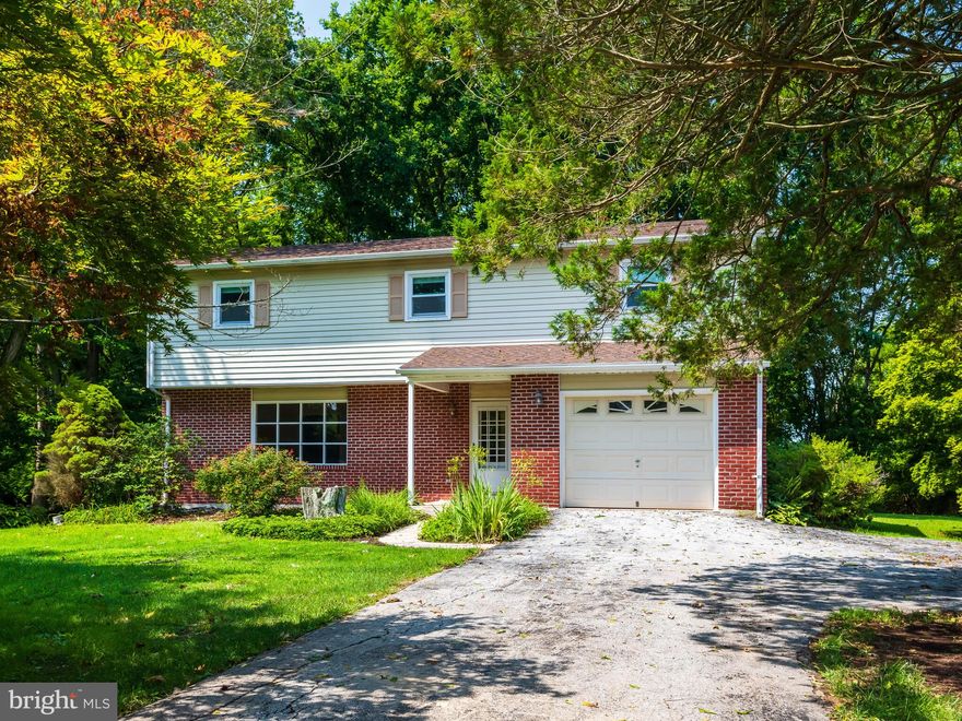 Situated on a beautiful 1-acre serene lot, this 4 Bedroom, 2.5 Bathroom home in Downingtown has TONS of recent updates including a New Roof (2020), New Kitchen Appliances (2020), New Well Pump (2019), New 200 Amp Service, New upstairs Carpet, Newer Windows throughout, New Brick Facing (2019) and the Whole House has been Freshly Painted. Centrally located, 460 N Guthriesville Road is just minutes to Routes 322 & 30 and Marsh Creek State Park. Step inside through the front Porch and into the Foyer with Coat Closet and access to the 1-Car Garage. Notice the New maintenance free flooring throughout the first floor. The sun lit Living Room has beautiful Crown Molding that runs throughout majority of the home. The Dining Room features a Ceiling Fan and Chair Rail and is off the Kitchen with Electric Range, Dishwasher and Refrigerator. Completing the first floor is the handy, tiled Powder Room and sunken Family Room with a large Brick, Wood burning Fireplace with mantle and Slider to the Deck. Step out onto the large Wooden Deck with Built-In Bench and overlook the private backyard featuring stone walking paths and gardens, it truly feels like you are in your own nature preserve. The yard is big and features mature trees and landscaping including a Fruiting Pear Tree and backs up to a wooded area for ultimate privacy. Heading back inside and upstairs, the Primary Bedroom boasts a ceiling fan, large Walk-In Closet and tiled Primary Bathroom with Updated Granite vanity and Shower/Tub Combination. The other three bedrooms are well sized with very nice closets; two of them being Walk-Ins. One of the bedrooms has a door with walk-up stairs to the Attic. The Hallway Bathroom is tiled with a Shower/Tub Combination and Linen Closet directly next to it in the hall. Completing the interior of this home is the Basement with Laundry facilities and walk out access to the Rear Yard. This space is just waiting to be transformed into a Rec Room, Gym, Office, or whatever best fits your lifestyle. Furnace was just replaced in 2013. Schedule to see this amazing home today!