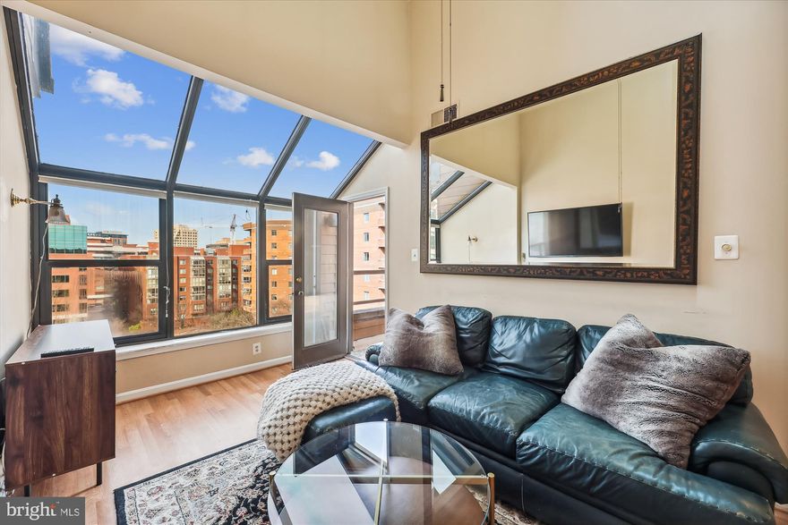 Prepared to be WOWED  by this lovely, top floor, 2-level Penthouse loft in the heart of Arlington!  Bright open spaces, with a wall of west facing windows for beautiful sunset views.  Over 1,000 s/f of living space.  Living room has vaulted ceilings, two skylights, and a wood-burning fireplace.  You can access the private balcony from either the living room or the main level bedroom.  The kitchen has stainless steel appliances, and granite countertops, with a pass-through countertop/bar to the dining/living room.  The upper level loft has an open view to the living room below,  a second bedroom,  2nd full bath, laundry, and walk-in closet. Extra storage space (712) and garage parking (space 109).  HVAC (8/20), HWH (8/20), Dishwasher(11/21), washer  and dryer (1/23) have all been replaced.  Just steps to the metro, Ballston Quarter, shops, restaurants and entertainment.  **Check out the virtual tour to see the interactive floor plan.