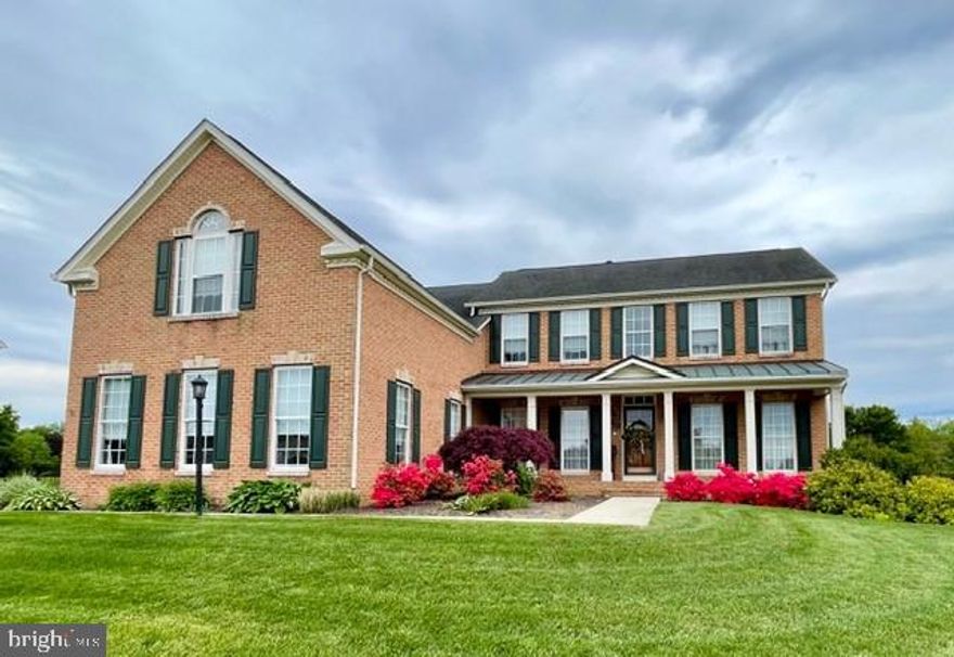 Welcome to this gorgeous brick front colonial located in Elmwood Farm on a half-acre lot! This Ryan classic home has a three-car side load garage with a long covered front porch and three finished levels totaling about 4,918 sq. ft.  Enter into the large foyer and look ahead past the graceful waterfall staircase to the expansive family room that features a dramatic 2-story sloped ceiling and gas fireplace. 
The dining room and living room are framed with decorative columns and open off the foyer. Throughout the first floor you will find 9' ceilings and hardwood flooring.  The stunning kitchen features a stone backsplash, granite countertops, an island, a breakfast bar, two pantries, and stainless appliances that include a double wall oven and cooktop. 
The spacious main level owner’s suite includes two walk-in closets. The owner’s bathroom has a large tiled shower, a jetted soaking tub and two granite countertop vanities.
A sunlit morning room leads to a beautiful and private outdoor living space with a 20’ x 28’ stamped concrete patio and a 12’ x 16’ storage shed. The laundry room is located just outside the owner’s suite and there is a first-floor powder room.
The upper level features a dramatic overlook to the family room below, three additional bedrooms and a full bath. A rare find is a 700+ sq. ft. Bonus Room over the three-car garage with it’s own full bathroom!
Need a fabulous entertainment area? The lower level has been designed for just that! You will find a large finished Recreation Room and a full bath. Relax in the Media Room with family and friends for a movie! There is also an abundance of storage space that includes two panel boxes with 200-amp service and surge protection, a Culligan water softener system, a 75-gallon hot water heater, an active radon remediation system and an oversized stairwell exit.
The two-zone HVAC system was completely replaced in 2014.
Do not miss this wonderfully exciting home!