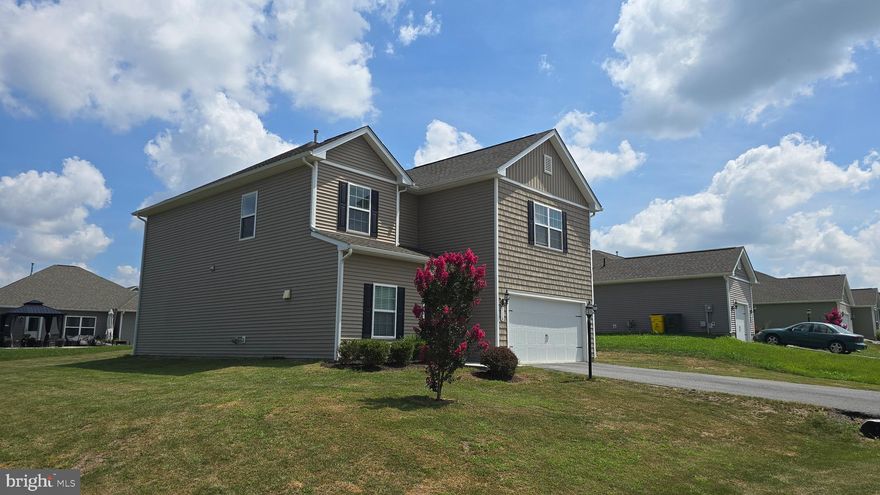 This exquisite Colonial-style residence, built in 2019, is situated in the desirable McGinnis Point subdivision. Spanning 2,626 square feet, this home features five spacious bedrooms and three and a half bathrooms, providing ample space for both relaxation and entertainment. The interior boasts an open floor plan, enhanced by elegant hardwood and plush carpet flooring. The formal dining room is perfect for hosting gatherings, while the well-appointed kitchen includes modern appliances such as a built-in microwave, dishwasher, and refrigerator, ensuring convenience for daily living. The primary bath offers a serene retreat, complemented by additional features like ceiling fans and a pantry for optimal organization. Externally, the property is set on a generous 0.22-acre corner lot, providing a sense of privacy and space. The exterior is adorned with tasteful lighting, enhancing the home's curb appeal. The attached front-entry garage accommodates two vehicles, with additional driveway space available. Residents of McGinnis Point benefit from a well-maintained community, with snow removal services included in the association fee. The neighborhood is conveniently located near reputable schools, parks, and essential public services, promoting an active and engaged lifestyle. Enjoy the tranquility of suburban living while remaining close to urban amenities. This property represents an exceptional opportunity for those seeking a modern home in a vibrant community.