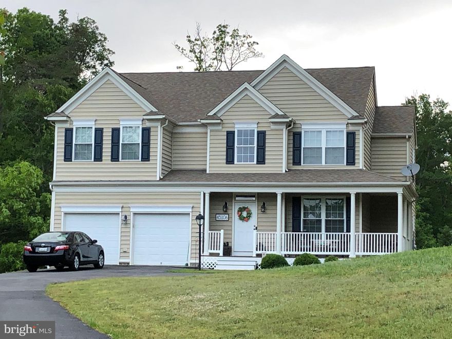 Homes in The Woods at Myrtle Point do not come up very often; and when they do come on the market they DO NOT last long.  This Colonial home can be your new home; if you act fast.  This home has been well maintained by it owners.  The house is nestled at the end of Woodhaven Dr. setback from the street with a long driveway.   It has the privacy of woods on one side with a beautifully landscaped yard that leads to a wraparound porch and a two (2) car garage.  As you enter the foyer notice you have great hard wood floors coupled with carpeted floors in the adjacent living areas.  Enjoy a cozy living room that could be re-worked into a private office if you have that need.  The kitchen and family room are open, with 9-foot ceilings, and great for family, friends or entertaining, the family room has a beautiful gas fireplace for warm evenings watching tv.  The kitchen has room for an eating table that also leads to a spacious deck that was added to the house in 2020.  The deck is great for outdoor living as well as hosting a summer gathering.  The kitchen features gas cooking on a built-in range, built in microwave, dishwasher, and a convenient pantry.  When you go upstairs you will notice a very convenient upstairs laundry room, three (3) nicely sized bedrooms as a great master suite.  The master bedroom/suite features a sitting area, large soaking tub, walk-in closets and a separate shower and double vanity.  The basement is fully finished and can serve as a rec room or a 5th bedroom, it has a separate area that is prewired for a theater room; and of course, there is a full bathroom downstairs.  There is a separate door with walk-up concrete stairs that lead to the yard.  The neighborhood has a great feel for community, and it is very close to Solomon’s Island and a short commute to PAX River Naval Air Station.  There are great dining and shopping choices.  Don’t miss out on this great home; schedule your showing today.