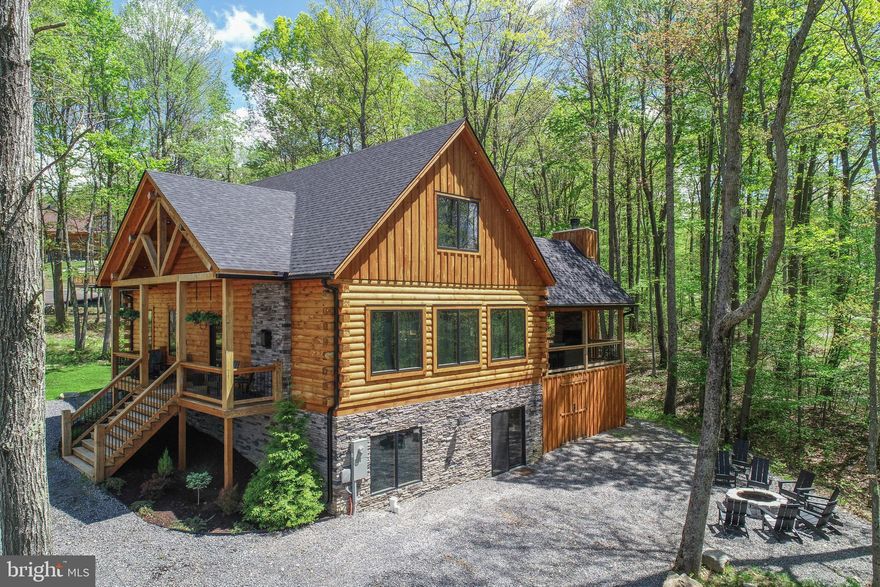 ***HOME IS AVAILABLE AGAIN AT NO FAULT TO THE PROPERTY*** Welcome to Black Diamond Lodge, a professionally designed and turnkey mountain retreat where luxury meets rustic charm. Your new mountaintop retreat is minutes from WISP ski resort, Deep Creek Lake, endless acres of state forest land and all the outdoor activities you could desire. As an established, active vacation rental property, this home provides an incredible opportunity for investors or those seeking a turnkey mountain escape with proven income production that out performs most comparable homes on the mountain. Consider the benefits of owning this property and assuming all future reservations already on the books for 2026! From the moment you arrive, gorgeous wood accents, 10' ceilings, and stunning decor throughout create a warm, elevated atmosphere that’s both inviting and unforgettable. This thoughtfully designed custom home offers six spacious bedrooms—two on each floor—a layout that perfectly balances privacy and togetherness. Four of the bedrooms are ensuite, providing comfort and convenience for family and guests alike. The main level features an open-concept design with a show-stopping kitchen, expansive living area, and ample dining space—ideal for gathering with friends and loved ones. A gas-burning fireplace and loads of natural light add the perfect mountaintop ambiance. On the lower level, enjoy a large family room, billiards table, and a gorgeous wet bar—offering even more space to relax or entertain. Step outside to a spacious, covered deck with vaulted ceilings and a wood-burning fireplace, the perfect spot to enjoy the fresh mountain breeze year-round. After dark, gather around the fire pit or unwind in the private hot tub under the stars. Whether you're looking for a luxurious full-time residence, a second home, or a premium rental investment, Black Diamond Lodge combines timeless style with modern comfort in a setting that truly feels like home. Call today for more information and to schedule your private tour!