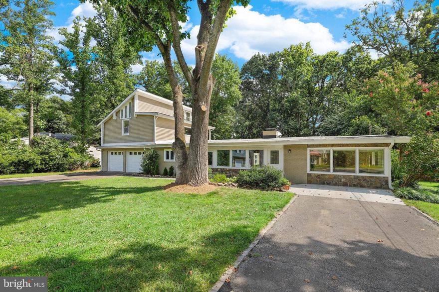 1/2 ACRE LOT MINUTES TO I-395, THE BELTWAY AND SHOPPING!
A FREE STANDING 20 x 20 BUILDING FOR OFFICE,  STUDIO, GUEST HOUSE, OR LIVING QUARTERS W/ AC AND ELECTRICITY!  
HUGE WINDOWS PROVIDE TONS OF NATURAL LIGHT!
Contemporary w/ high ceilings and new flooring.  Wood burning fireplace.  Family room off renovated kitchen.  From dining area french doors to the patio.   One of the two laundry areas is located here and second laundry hookup in the utility/storage room on the other end of the house.  Main level w/ two generously sized bedrooms,  2 remodeled bathrooms and an office area.  The two story addition features a third bedroom with a living area, soaring ceilings, new carpeting and an abundance of windows creating fabulous natural light.  A large balcony overlooks the yard-a great place to relax.  The primary remodeled bathroom includes double sinks, separate shower and a jacuzzi tub.  A two car oversized garage and adjacent utility room with exterior access could easily be a workshop, storage area or play area.   The yard features multiple gardens which have continuous color including rhododendron, tulips, daffodils, hostas, yuccas, crepe myrtles, a mimosa tree, azaleas and others.  Two wide driveways provide space for multiple vehicles.  Roof replaced in 2018 on main house and in 2022 on the addition.  The upper level HVAC was replaced 2 years ago and the kitchen was remodeled in 2018.   Freshly painted, this home is ready for its new owners! Within a few blocks of the Lincolnia Park Recreational Club, neighbors enjoy pool and tennis.  Only 3 miles west of the 4M SF mixed-use redevelopment of the 52-acre Landmark mall (rebranded West End) which will include the relocated  Alexandria Inova Hospital as well as residential, retail, commercial and entertainment offerings.  The first buildings are scheduled to be completed in 2025.   OPEN SUNDAY ....come on by!