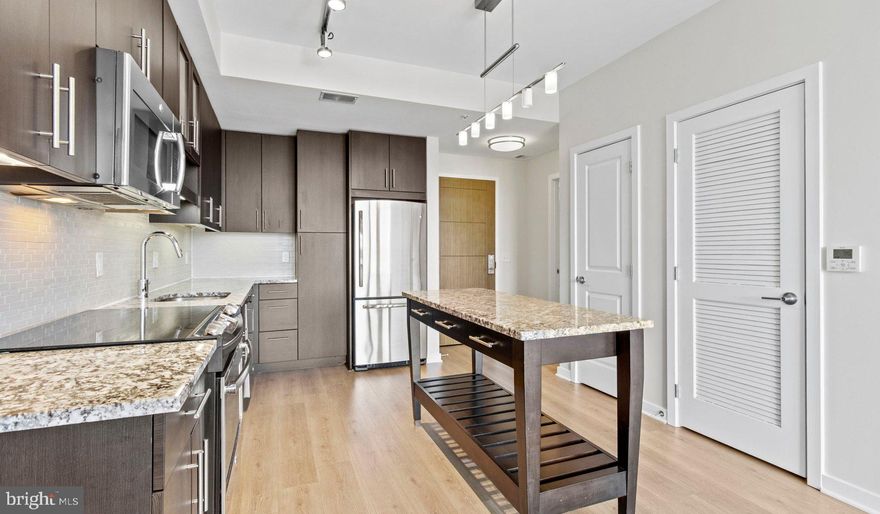 Nestled in the vibrant heart of Bethesda, Maryland, this luxury apartment complex offers an unparalleled living experience that combines modern convenience with sophisticated design. Designed to cater to the discerning tastes of urban dwellers, this property stands as a testament to luxury living, where every detail has been meticulously crafted to ensure the utmost in comfort and style.

*Exceptional Location*
Located in the sought-after Woodmont district, the apartment complex is perfectly positioned as a gateway to the best that Bethesda has to offer. Residents enjoy easy access to a plethora of amenities, including the Walter Reed National Military Medical Center, the NIH, and a variety of shopping, dining, and entertainment options. The prime location also offers convenient access to public transportation, making it easy to explore the wider metropolitan area.

*Architectural Elegance and Design*
The building's U-shaped design opens up to a beautifully landscaped courtyard, offering a seamless transition from the bustling city life to a tranquil oasis. The architecture is both richly textured and humanly scaled, creating an inviting streetscape that residents are proud to call home. A dramatic window wall façade and ground-level duplex units with front porches and planters further enhance the building's aesthetic appeal.

*Luxurious Amenities*
Residents of this apartment complex enjoy access to an array of exceptional amenities designed to enhance their lifestyle. The property boasts a large fitness center, fireside lounges, and a rooftop lounge equipped with bars, fireplaces, grilling areas, and two pools. Additionally, the convenience of having a 50,000 square foot grocery store within the building cannot be overstated. The property is also LEED Gold Certified, reflecting a commitment to environmental sustainability.

*Sophisticated Living Spaces*
The apartments themselves are a reflection of the luxury and sophistication that define the property. With a variety of floor plans, including studios, one to three-bedroom apartments, and townhomes, there is something to suit every preference. Each unit features designer finishes, stainless steel appliances, and spacious layouts that make coming home a pleasure.

*Community and Convenience*
The property is known for its friendly and helpful staff, ensuring that the needs of residents are met with professionalism and care. The well-maintained common areas and the sense of community fostered among residents make this complex more than just a place to live—it's a place to belong.

This luxury apartment complex in Bethesda, Maryland, offers an unmatched living experience for those seeking the best in urban living. With its prime location, architectural elegance, luxurious amenities, and sophisticated living spaces, it stands as a beacon of modern luxury and convenience. Realtors and renters looking for a property that combines the vibrancy of city life with the comfort of upscale living will find everything they desire and more at this premier apartment complex.

** Pricing and availability subject to change on a daily basis ** Photos are of model units ** Parking may be available for additional fee **