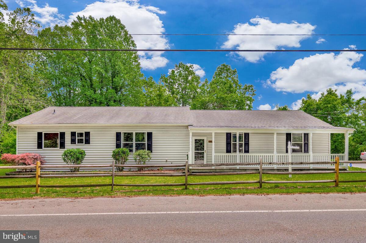 Large rambler with open floor plan on 1.2 acres. This home offers a huge kitchen with a massive peninsula for plenty of bar stools plus, a separate island, tons of counter space making it a perfect place to host a party or family gathering. The Great Room has a high vaulted ceilings and plenty of space for Family Room and Dining Room areas. Split bedroom floor plan with Primary Bedroom with vaulted ceiling on one side of the living space and 3 generous sized Bedrooms on the other. The Primary Bedroom offers a walk-in closet, an attached Bathroom with soaking tub and separate shower plus a sliding glass door that leads out to the patio for added relaxation. Lastly, there is an oversized 2 car garage, front porch and paved driveway with plenty of parking.
Lower level 30X18 tons of storage