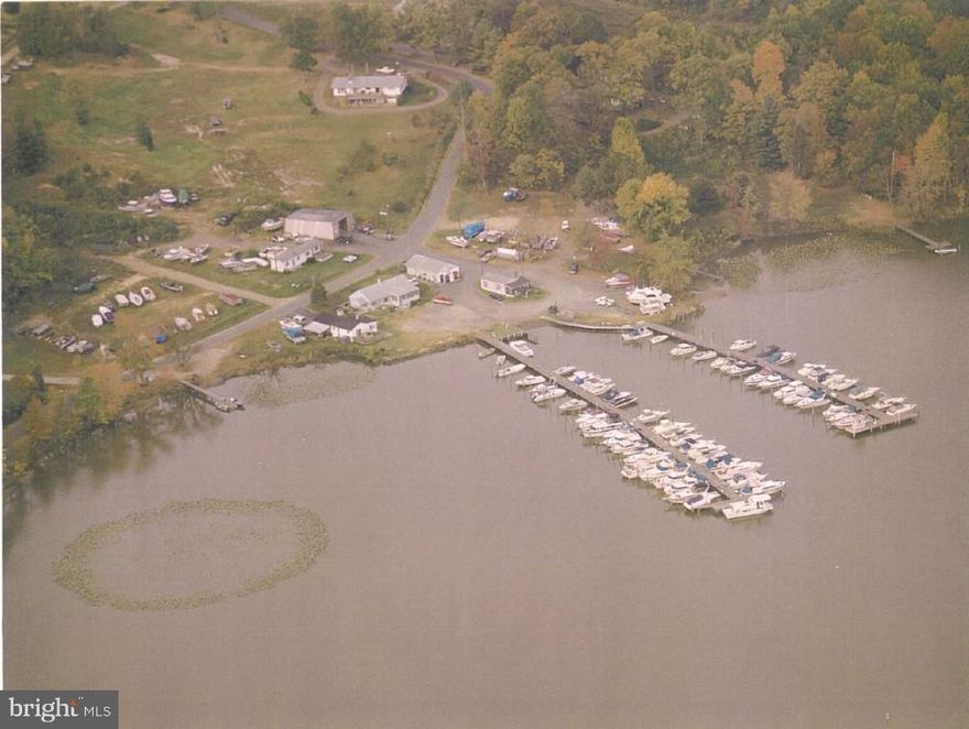 FULL SERVICE MARINA. 93 SLIPS, 48 WITH ELECTRIC AND WATER. 45 SLIPS WITH COMMUNITY ELECTRIC AND WATER. COUNTY WATER AND SEPTIC SYSTEM. 60 x40 REPAIR SHOP, 2 OFFICES, PARTS & SHOWROOM. 2 FULL BATHS WITH SHOWERS. OWNERS HOUSE WITH 3 BEDROOMS & 2 BATHS AND DECK. DETACHED GARAGE AND STORE AREA WHICH COULD BE A 1 BEDROOM 1 BATH UNIT WITH DECK  FACING THE WATER. ALSO A TRAILER AND ENCLOSED CONCRETE SLAB CURRENTLY LEASED TO A BOAT CANVAS BUSINESS. LOTS OF DRY STOREAGE. CURRENTLY LEASING AN ADDITIONAL 1.5 ACRE LOT FOR ADDED DRY STOREAGE. 2 PIERS WITH BOAT LAUNCH RAMP. LOCATED 2 MILES FROM THE POTOMAC RIVER WITH ACCESS TO WASHINGTON DC AND THE CHESEPEAK BAY. SHOWN BY APPOINTMENT WITH THE OWNER AND LISTING AGENT.