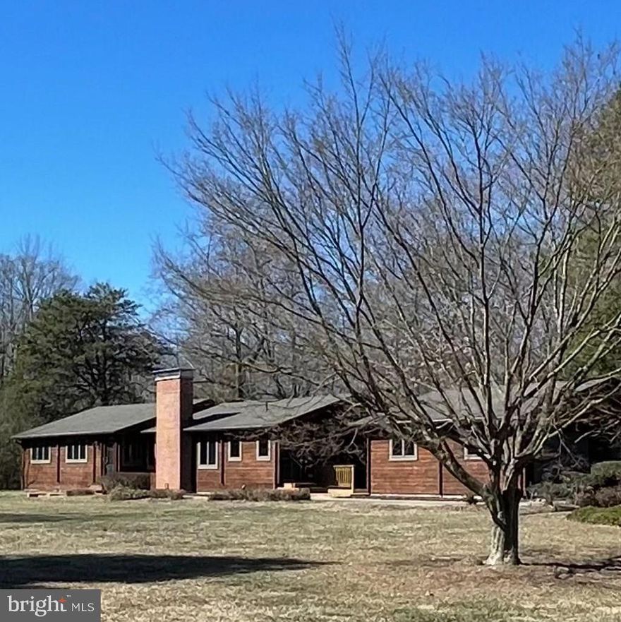 This delightful rambler offers the perfect combination of comfort and convenience, with three spacious bedrooms and two full bathrooms. Located just a short stroll from the water, you’ll enjoy peaceful mornings and stunning sunsets right at your doorstep. The open layout provides a welcoming atmosphere, ideal for both relaxing and entertaining. With a large backyard, there’s plenty of space for outdoor activities or simply unwinding in a serene setting. Don’t miss out on this rare opportunity to live close to the water in a beautifully maintained home. The exterior was professionally stained/clear coated in 2022 with top-of-the-line Permachink Lifeline ultra-Stain & clear coat. Hot water heater replaced in 2022. Chimney flashing, crown and cap were replaced in 2022. Home also comes with a backup generator.  This beauty will not last long. Schedule your showing TODAY!!