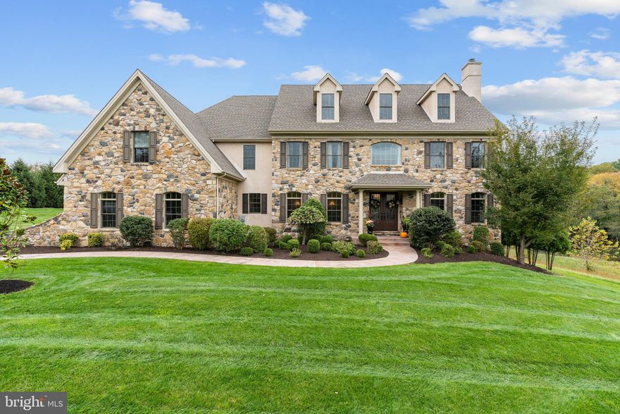 Welcome to 5 Colonial Drive in Parker Preserve! This magnificent 6 BR, 6.2 bath home sits in an idyllic setting overlooking 36 acres of  open space. Dambro, custom-built home with 6,282 SF of living space on the first and second floors and approximately 2,500  SF in the basement.  Double 10' front entry doors lead to dramatic  "view through" entrance foyer with gleaming hardwood floors and medallion accents.  Grand foyer flanked by formal living room with gas fireplace and marble hearth and formal dining room with wainscoating.  Natural light abounds as you seamlessly flow through and catch glimpses of the preserve surrounding the rear and right of property.  Ideal for entertaining, formal wet bar complete with beverage fridge and butler's pantry carry you to large gourmet kitchen.  Kitchen features antique white cabinetry, spacious center island with wolf 8 burner cooktop, pot-filler, Subzero refrigerator, dual Wolf wall ovens, granite countertops, & tumble backsplash.  Morning room with kitchen table open to spacious family room with wood burning fireplace and coffered ceiling .  French doors to trex deck offering gorgeous views, open from morning room and rear foyer.   Office, sitting room and formal powder complete formal space.  Mud room off of garage ideal for modern family complete with second powder room.  Spacious landing leading to beautiful master with siting room and gas fireplace with custom built-ins and large walk-in closets. Luxurious master bath with dual vanities, oversized shower and whirlpool bath.  4 additional bedrooms on second floor are all ensuite with custom baths with granite and tile surrounds.  Oversized laundry room at the top of back staircase complete 2nd floor.  Spacious and inviting finished lower level with daylight windows and walk-out.  Entertainment area with with gas fireplace and custom built mantel, oversized bar with dishwasher and refrigerator.  Full bedroom with bath; media/fitness room and large unfinished area for storage with private stairs leading to garage.  Covered side porch next to garage.  3-zone HVAC.  Stucco inspection complete.