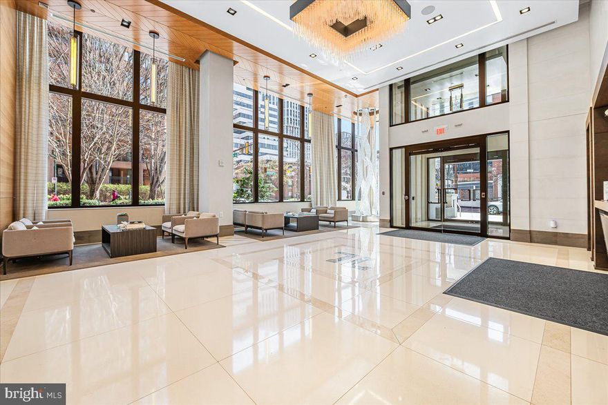 Unit 203: Where Boutique Luxury Living Meets Downtown Ease.  Unit 203 offers a perfect balance of privacy and presence in the heart of Downtown Bethesda. Spanning close to 2,200 square feet,  this expansive two-bedroom, two and half bath unit with den, features a whisper-quiet elevator that opens directly into your foyer. The rooms and the open living area are large and spacious. The chef’s kitchen features professional-grade appliances by Wolf and Sub-Zero. You will love the owner's bathroom, with its double sink vanity, soaking tub, and separate shower. A versatile den features a discreet "hidden desk" for the modern professional. A dedicated, oversized laundry room is equipped with full-size Whirlpool appliances and a deep utility sink. Two premium parking spaces with EV charger are situated just steps from your private elevator portal for effortless entry and exit. This is more than a residence- it is a testament to refined urban living. Amenities at The Lauren include:  private fitness studio, rooftop terrace, and private lounge for entertaining family and friends.  The peace of mind provided by the 24-hour concierge, the on-site maintenance manager, and the building manager makes living at The Lauren more than a home—it defines luxury like no other.