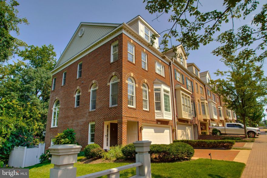 Wow!   Nestled in the charming Palisades Park community in Rosslyn, this delightful end townhouse offers a perfect blend of location and style. With one of the best lots in the community, it backs and sides to wooded Arlington County parkland! Built in 1996, the home features a timeless Federal architectural design, showcasing elegant brick construction that stands the test of time. Step inside to discover a warm and inviting interior, where natural light dances through Palladian windows. The spacious layout includes three bedrooms and two full bathrooms, complemented by two convenient half baths. The gourmet kitchen, equipped with stainless steel appliances, a double oven, and upgraded countertops, is perfect for culinary enthusiasts. Enjoy meals in the cozy breakfast area or the formal dining room, both designed for gatherings and celebrations. You'll love the fabulous remodeled primary bath! The fully finished basement with a walkout level provides additional living space, ideal for a family room or home office. Relax by the gas fireplace in the family room, or unwind on the deck overlooking the serene parkland and trees that back the property, creating a private oasis. Outside, the meticulously maintained lot features sidewalks and a secluded rear yard, perfect for outdoor activities. With an attached two-car garage and ample driveway space, parking is a breeze. Located in an urban setting with easy access to public transportation, this home is a rare find. Enjoy the convenience of nearby amenities while relishing the tranquility of your own retreat. Walk through this home right now by clicking the Tours button to access the 3D Matterport tour!  Experience the perfect blend of comfort, style, and location in this beautiful townhouse. Open August 10th from 1 to 3 pm.  Come see!
