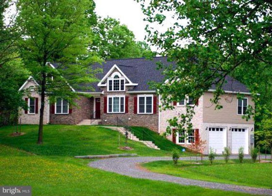 Stunning home, feels like the country yet close to everything! Sep.living/dining rm,huge family rm,large private deck,3 bedrms, 3 baths on main level.4 baths total!  Basement level au pair suite with 2 bedrms,1 bath, rec rm with wetbar, storage. Private upper level office or bedrm. Custom home design and 2 car garage **Tax Records show square footage prior to basement and upper level being finish!