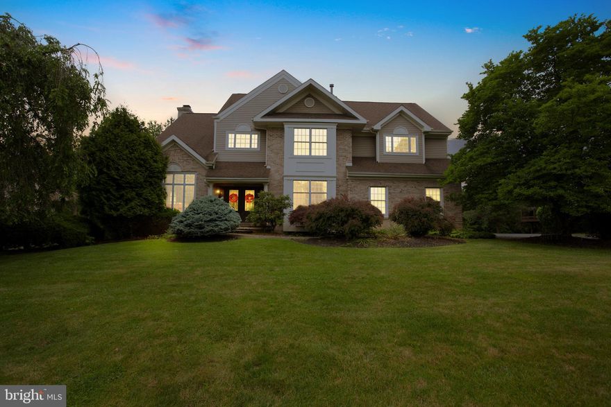 Welcome to this gracious 4-bedroom, 3.5-bath home in the highly regarded Hills at Northampton. Situated on nearly half an acre, this expansive residence offers over 3,000 square feet of thoughtfully designed living space, a finished walkout basement, and exceptional indoor-outdoor flow. Beautiful curb appeal sets the tone, with manicured landscaping and a covered front entry welcoming you inside. A dramatic two-story foyer leads to an elegant layout that blends functionality with timeless style. The living room features a vaulted ceiling that enhances the sense of space and light, while the great room includes a fireplace flanked by custom built-in shelving - perfect for both everyday living and entertaining. The formal dining room showcases hardwood flooring and refined millwork, and connects seamlessly to the kitchen via a butler’s pantry. The bright, eat-in kitchen offers white cabinetry, a center island, a large pantry, abundant cabinet space, and a picture window overlooking the backyard. Step directly from the kitchen into a thoughtfully designed outdoor living space with multiple tiers for dining and entertaining - partially covered and equipped with a ceiling fan for added comfort. All of this overlooks a beautifully landscaped lot that enhances the home’s setting and offers plenty of space to enjoy the outdoors. Upstairs, the impressive primary suite features a vaulted ceiling, hardwood flooring, a sitting area, generous custom closet space, and an en suite bath with a soaking tub and double vanity. Three additional bedrooms share a full hall bath, offering flexible space for a variety of needs. The finished walkout basement extends the living space with a fifth bedroom, full bath, and a large open area ideal for recreation, work, or relaxation. Recessed lighting adds a polished touch in many areas, while a neutral, modern color palette creates a cohesive, serene atmosphere throughout the home. Additional highlights include a whole-house generator - offering peace of mind. Appreciate convenient access to I-95, Philadelphia, Princeton, and NYC, all while enjoying the unique charms of Bucks County living. Indulge in the local restaurants, shopping, and recreational activities in Holland and its neighboring communities. All of this comes alongside the highly-rated Council Rock School District.