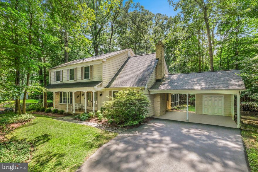 Welcome to 8212 Killean Way, a charming colonial tucked on a quiet cul-de-sac in the highly sought-after Inverness Forest community of Potomac. Offering a total of 3,268 square feet, this home features five spacious bedrooms, two full bathrooms, and a convenient powder room. Updates include a new roof (2019), replacement of all original windows, an upper-level bathroom renovation (2014), and a new stove, microwave, and dishwasher (approximately 2022). Set on a private .35-acre lot, the property enjoys serene wooded views. A highlight of this home is the backyard retreat, surrounded by mature landscaping. It features a large screened porch with a vaulted ceiling, ceiling fan, and walk-out access to an outdoor patio — ideal for both everyday relaxation and entertaining. A flagstone walk, front porch, and double doors welcome you inside. The interior showcases light-filled living spaces, fresh paint, refinished hardwood floors on the main and upper levels, recessed lighting, generous room sizes, and an abundance of windows that fill the home with natural light. At the heart of the home, the kitchen includes a peninsula island, built-in desk/work space, ample cabinetry, a pantry with roll-out drawers, and a breakfast area framed by windows. The adjacent family room features a fireplace set within a brick accent wall, flanked by built-in bookshelves. Spacious living and dining rooms, a powder room, and a mud/laundry room with carport access complete the main level. Upstairs, you’ll find five bedrooms and two full bathrooms. The spacious primary suite offers a walk-in closet plus an additional auxiliary closet, along with an en-suite bath featuring a glass-door shower, modern tile finishes, and a separate vanity. Four additional bedrooms, a full hall bath, and a linen closet complete this level. The lower level provides a sizable recreation room with Bilco door  exterior access, as well as a large utility room offering abundant storage space. Ideally situated between Tuckerman Lane and Seven Locks Road, this home provides easy access to shopping, dining, entertainment, and major commuter routes. Close to parks, recreation, and nationally rated golf courses, and served by top-rated Montgomery County schools.