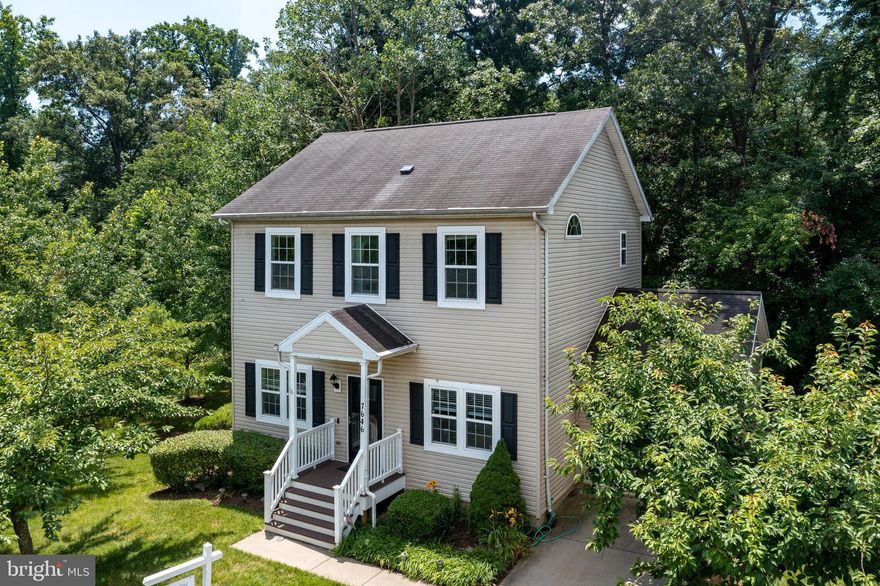 This spacious colonial is on one of the most private lots in in the gated community of New Colony Village.  Enter the main level and admire the re-engineered wood floors throughout.  The open floorplan on this level is great for entertaining. The living room, dining room, kitchen, half bathroom and sitting room are all on this level. The sitting room can also be used as an office. The top level has three large bedrooms, laundry room and two full bathrooms. The primary bedroom ensuite with a full bathroom that has a jetted oversized tub and a large walk in closet with build-ins for storage. The lower level features a family room with a gas fireplace, kitchenette, a bonus room and a full bathroom.  The deck off of the dining room  make for a perfect entertaining space. If you feel extra adventurous check out the fun tree house. 

Updates in recent years include new flooring ( luxury vinyl plank, re-engineered wood, and carpet), kitchen appliances, and insulated garage door.

This gated community was built with "neighborhood" in mind. The community amenities include swimming pool, exercise room, basketball court, tot lot, gazebo, walking path and a clubhouse. The landscaping and lawn grass cutting are included in the HOA fees. 

This property is within a few minutes to I-95 and within commuting distance to Baltimore, Washington, D.C., Fort Meade and Silver Spring.