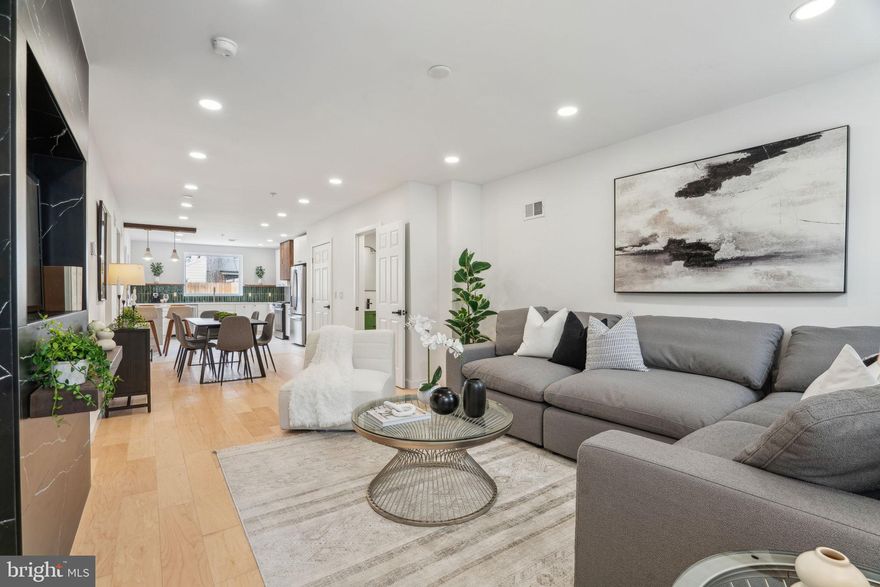 Welcome to 2330 E Fletcher Street. Fishtown living at it's most stunning and finest. As soon as you enter you will love the floor plan that seamlessly blends from the family room to the dining room to the kitchen. The family room is cozy yet modern with a slate inset TV wall mount and a floating shelf. The dining room is open and perfect for a dinner party that flows right into the chef's kitchen. Quartz countertops, a bright backsplash, stainless steel appliances, potfiller, and large windows make this kitchen a dream.  Off the kitchen is the backyard with an equal part concrete patio and grass for your furry friend. Off the dining room, you'll find a handsome half bath and separately access to the partially finished basement. Upstairs is a nice and spacious landing with a washer and dryer. The back bedroom is a great size with ample closet space and an en-suite bathroom. Down the hall in the front bedroom, you will also find another en-suite bathroom. All the privacy for your family and guests. Upstairs is your primary suite floor. The walk-in closet is fully outfitted for you to move right in. Next door is the large bedroom with a vaulted ceiling. Directly next to the closet is the most stunning primary bathroom you've ever seen. With custom tile work in the shower and a standalone soaking tub, you will love unwinding there after a long day. To complete the primary suite, floor is a private back deck that overlooks the backyard. This Fishtown property is located right near Riverwards, ReAnimator Coffee, Cedar Point, and Loco Pez, PLUS easy access to public transit and the Frankford Ave food scene. This home is approved for a 10-year tax abatement.