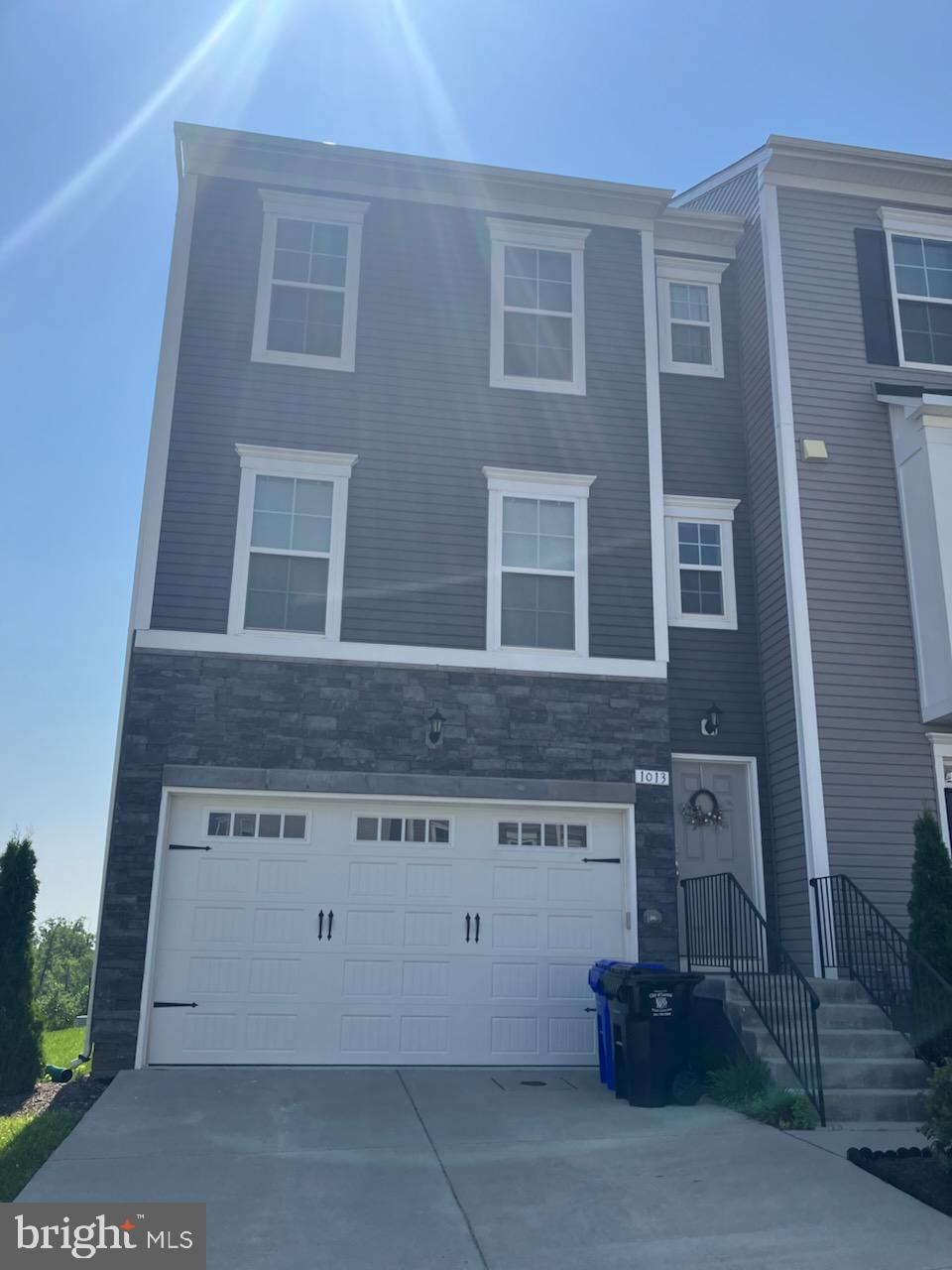 Large stunning end unit townhome+-.Moving out- Open House August 3, -from 1-3:00 pm Enjoy the spacious kitchen with loads of natural light, Enjoy the kitchen with bright white cabinetry impressive 12 foot island, beautiful quartz countertops, and stainless- steel appliances, double conventional oven. Custom top down/bottom up blinds in the living room and kitchen area. Open concept living area is perfect for entertainment, Retire to the luxurious bedroom suite for relaxation with a large walk-in closet, with custom room darkening, fabric top down/bottom up blinds for a peaceful slumber. This townhome has 9-foot ceilings, recess lighting throughout and offers the perfect blend of indoor and outdoor living, to the beautiful deck off the back of the home. A large backyard which backs up to large back yard to an open field. Plenty of storage options accessible from the garage, a hidden away under the entry stairwell and overhead storage rack. Don't let this opportunity to make this your new home