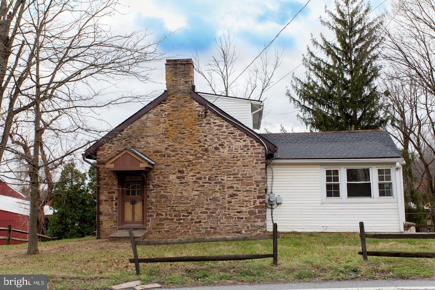 A charming classic old Bucks County stone house which has been expanded over the years.  Built in 1765, this house was once the home of Doylestown native and renowned Bucks County artist George Booz Jr.  Over the years, it has gone through expansions and remodeling, resulting in a very comfortable home yet still retaining much of the original charm including multiple exposed stone walls, beams and fireplaces.  The main level includes a large eat in kitchen, dining room, and the amazing Great Room with exposed beams, deep windows, fireplace, and the stairway leading to the upper level.  The main level also includes another separate room and full bath which could easily be a main level master.  The upper level provides another great space with a full bath which was most recently used as a bedroom with additional living space.  The lower level includes another bedroom plus a full bath, laundry area, the original basement of the house as well as a study/office/library with a large old fireplace and built ins.  Wooden floors accent the old world charm while several newer windows add to the efficiency.  The newer large detached three car garage features a stairway to an upper level which provides fantastic storage space, or for whatever your imagination lands on.  Conveniently located near Doylestown, New Hope and NJ.  Central Bucks schools.   Come and experience it today!  Inspections are welcomed although property is being sold as is.