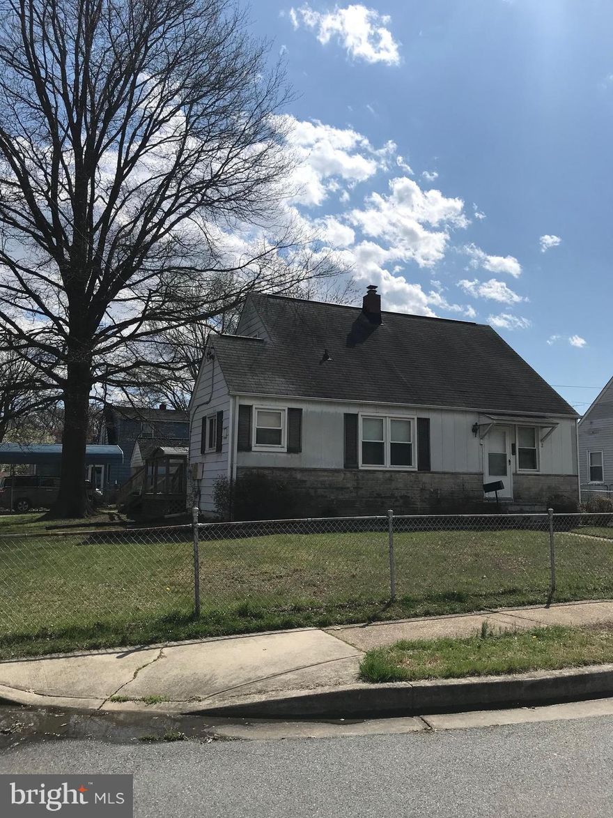 ATTENTION INVESTORS! Potential abounds! Diamond in the rough. Offers hardwood floors under carpet in many rooms. Separate dining room. 2 clothes washers and 2 clothes dryers plus freezer & extra refrigerator in basement included. Fenced yard. Driveway w/carport. SOLD AS-IS!  Cash only.