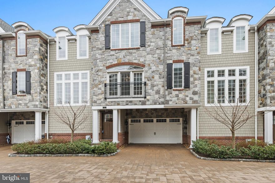 Don’t miss this 7-year young, move-in ready, 3-4 BD, 4/2 BA townhouse in popular walk-to-Wayne location! With a premier site in the rear of this enclave of 11 luxury carriage homes, this unit is sheltered from exposure to streets and parking areas, and has great privacy and sweeping scenic views. The Ground Level has a barrel-vaulted Entrance Hall with arched wood beams, beadboard, large Entertainment Room with gas fireplace, and hallway with glass doors to the covered rear patio. Don’t miss the Mudroom with custom built-in cabinets, tiled dog-washing station, washer/dryer hookups, and direct access to the 2-car Garage. A Powder Room and custom closet complete this level. Take the stairs, or use the ELEVATOR, to access ALL 4 levels of finished living space. Main Level has formal Dining Room with designer chandelier, a very large Great Room with coffered ceiling and custom built-ins flanking a 2nd gas fireplace, and the private Office with a wall of built-in storage cabinets. Chefs will appreciate the gourmet Kitchen with high end appliances, including SubZero frig, Wolf 6-burner gas range with griddle and 2 ovens, and expansive granite counter space, incl. an island with barstool seating. The Breakfast Area has a wall of windows overlooking open space, which is also visible from the large, low maintenance, composite deck. The Butlers Pantry/Bar area features more custom cabinets and a beverage frig. This level also has a very large walk-in closet and Powder Room #2. The top floor features a Master Bedroom suite with paneled tray ceiling, several closets (2 walk-in!), expansive Master Bath with frameless glass-enclosed shower, separate soaking tub, double vanity, private toilet room, enhanced cabinetry, plus Samsung washer and dryer. 2 more Bedrooms, each with en suite full Baths, are also on this level. The finished Lower Level has a large Rec Room/4th Bedroom with egress window and 4th full Bath, walk-in closet, and two storage/utility rooms. You’ll love the soaring ceiling heights, custom closets, designer fixtures, enhanced millwork, and gleaming wood floors. Ask for the list of over $300,000 in upgrades! Come enjoy a maintenance-free lifestyle in a convenient location within walking distance of DiBruno Brothers, Lancaster County Farmers Market, The Shops at Eagle Village, train stations, and events, dining, and shopping in the charming village of Wayne. Easy access to Center City, Blue Route, and Airport, plus highly-ranked Radnor Township schools. LOW taxes compared to most similar units!