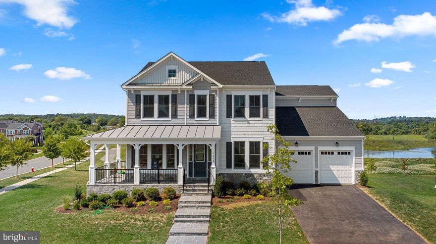 NOT your ordinary House for Sale! This is the last chance to own a BRAND NEW HOME in the highly sought-after neighborhood of Meadowbrook Farm in Leesburg, Virginia! AND it’s on a prime .43 acre corner Lot with water views! This home is truly special. Built by Van Metre Design + Build, this Custom BELMONT Floorplan is brimming with high-end features from top to bottom!

Featuring an enhanced Craftsman Elevation with wrap around porch, Hardiplank siding, and flagstone porch, this incredible property boasts more than 5,400 square feet over 3 finished levels with 6 bedrooms, 5.5 bathrooms, and a 2-car FINISHED garage. 

Entering on the MAIN LEVEL, you can’t miss the lofty 9ft ceilings and high-end wide plank engineered Hardwood flooring leading through the formal dining room, living room (or office space), wide open Family Room with Linear gas fireplace, main level Bedroom w/ensuite full bathroom, a dream Mud Room with built-in coat rack/storage cubbies, and of course the show-stopping KITCHEN.

Let’s talk about this Luxury Kitchen! GE Café Collection® stainless steel kitchen appliances featuring a 48” chef’s range and custom wood range hood, upgraded soft-close cabinetry, Quartz countertops, butler's pantry, and huge center island. You’ll be PROUD to entertain in this incredible space!!

Heading up the hardwood stairs to the UPPER LEVEL, you’ll enjoy gorgeous water views from the huge Primary Suite with coffered ceiling and large sitting area, dual walk-in closets, and sophisticated Primary Bathroom with double sinks, Quartz countertops, oversized frameless shower, and a freestanding tub. Also on the upper level you’ll find three additional secondary bedrooms, two full baths, and a convenient upstairs laundry room. 

WOW!! The finished WALKOUT Lower Level is equipped with a wide-open Rec Room, 6th Bedroom, and 5th Full Bathroom. It’s the absolute perfect space for Movie Night with family or friends, or a relaxing retreat for extended guests. 

Heading outdoors, the Trex® deck helps expand your living space to the outside allowing you to enjoy the beautiful water views.

Van Metre Design + Build has crafted an incredibly well-built home meeting the highest energy-efficiency standards. PLUS it’s never been lived in, and comes with a  HOME WARRANTY! Closing cost assistance available when working with Intercoastal Mortgage and Walker Title.

It’s no secret that Meadowbrook Farm has quickly become one of the BEST neighborhoods in Loudoun County. With its Craftsman-style homes, open green spaces, welcoming front porches, and sidewalks perfect for an evening stroll, residents are proud to call Meadowbrook Farm their home. Amenities include playgrounds, tennis courts, an outdoor swimming pool, well-appointed clubhouse, and fun-for-all  community events! Commuting? Meadowbrook Farm provides easy access to Rte 7, Rte 15, and the Dulles Toll Road (Rte 267).