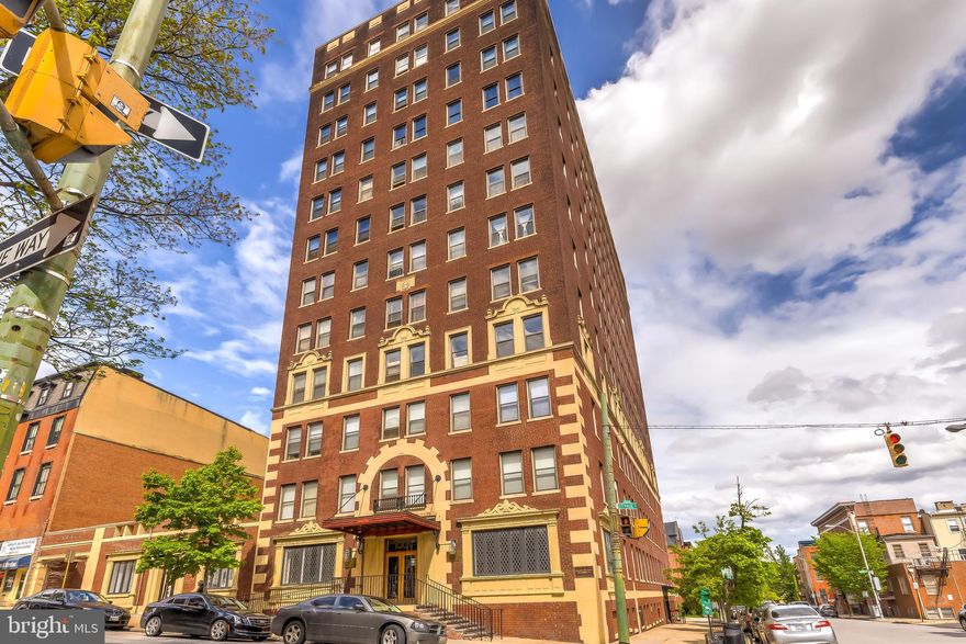 Bright, stylish, and smartly designed – welcome to your sun-drenched urban retreat in the heart of historic Mt. Vernon.

This beautifully laid-out condo enjoys southern exposure, flooding the space with natural light throughout the day and offering breathtaking views of the downtown skyline. The thoughtful floor plan makes excellent use of every square foot, creating a home that feels both open and inviting.

The upgraded kitchen features granite countertops and sleek new stainless steel appliances, including a refrigerator, range, and range hood that pair beautifully with the stainless-look dishwasher – blending modern functionality with timeless style.

Parking fee runs $165 a month. (The rental is optional, though there may be a waiting list for parking if released.)

Life at this full-service building includes wonderful conveniences:

24/7 front desk and security

On-site convenience store

Laundry room with dry cleaning pickup and delivery

A spectacular rooftop terrace with panoramic views of the city and the Washington Monument

Set in one of Baltimore’s most vibrant and culturally rich neighborhoods, you’ll be surrounded by grand historic mansions, leafy parks, charming shops, and some of the city’s best restaurants and institutions. Commuters will love the easy walk to Penn Station for quick trips to D.C. or NYC, and the nearby I-83 ramp makes getting downtown a breeze.