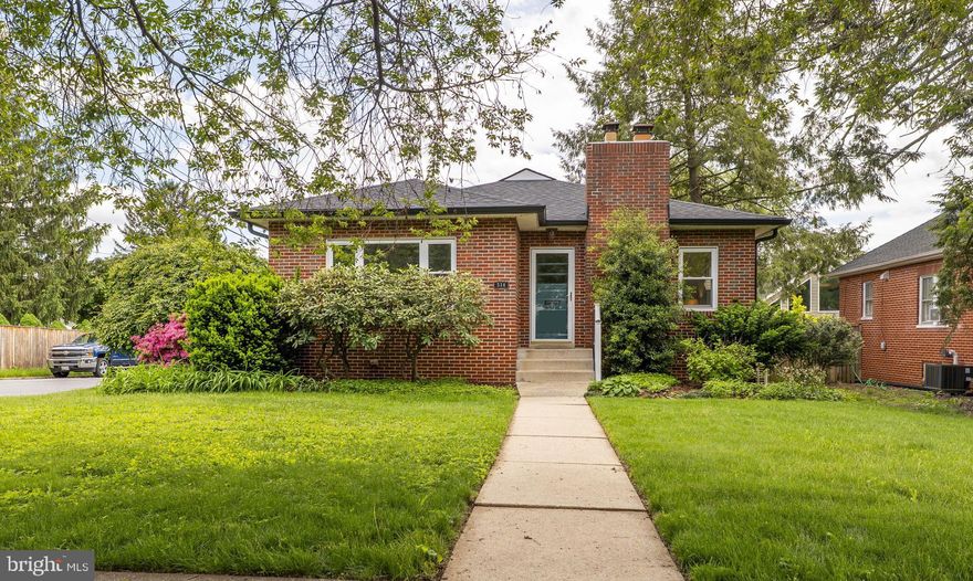 Welcome to this delightful 3-bedroom brick rambler nestled on a spacious corner lot, offering classic charm with thoughtful modern updates. From the moment you arrive, you'll appreciate the character and warmth this home exudes, from its solid brick construction to its inviting interior spaces.

Step inside to a cozy atmosphere highlighted by hardwood floors that flow throughout the main level. The living room features a wood-burning fireplace, perfect for chilly evenings, and opens to a formal dining room ideal for entertaining. The updated kitchen shines with stainless steel appliances and offers a spacious pantry for all your storage needs.

Three comfortable bedrooms and a full bath are conveniently located on the entry level. Downstairs, the finished lower level expands your living space with a large recreation room that walks out to the backyard, a private office, an updated full bath, laundry area, a versatile bonus room, and a dedicated workshop for hobbies or storage.

Outside, enjoy the benefits of a detached, oversized two-car garage and a location that can’t be beat—just minutes to shopping, dining, Hood College, Baker Park, and major commuter routes. This is a home with heart, history, and room to grow.

Don’t miss your chance to own this charming retreat in a wonderfully convenient location.