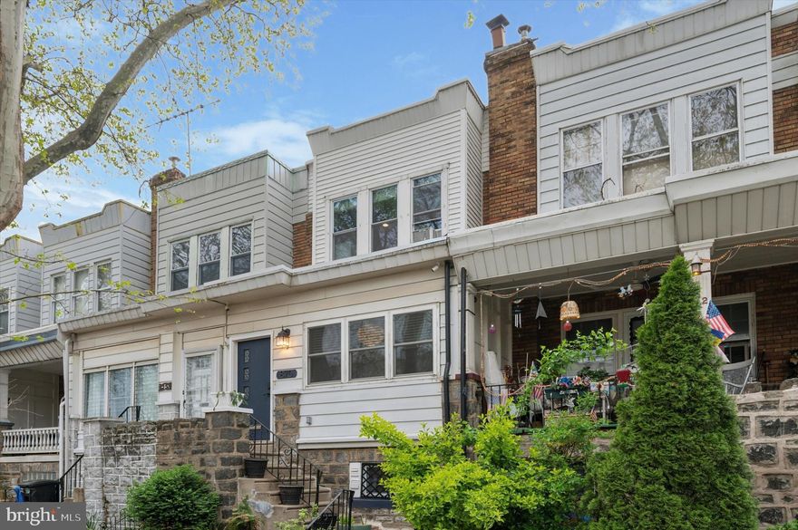 Welcome to 870 N 21st Street—nestled on a picturesque, tree-lined block in the heart of Fairmount, this beautifully maintained 3-bedroom, 1.5-bath home blends modern comfort with artisan character in one of Philadelphia’s most walkable and vibrant neighborhoods.

Step through the convenient entry foyer, where tongue-and-groove wood ceilings, a stylish pendant light, and custom-built storage make everyday transitions seamless. The first floor impresses with its wide, open layout, hardwood floors, and recessed lighting throughout—offering versatile options for living and dining. A wood-burning fireplace not only adds warmth and ambiance, but also creates a natural sense of separation between the living room and the flexible dining area. A custom dry bar with accent lighting adds a chic, functional touch for entertaining.

The kitchen is both spacious and private, featuring crisp white shaker cabinetry, tile backsplash, farmhouse sink, black hardware and fixtures, and under-cabinet lighting—all opening directly to a private rear deck with a retractable awning, perfect for dining al fresco or morning coffee.

The powder room is a standout with its antique lited door, live-edge floating vanity, basin sink, and curated design details.

Upstairs, you’ll find three generous bedrooms and a full bath. The primary suite boasts three large windows overlooking the tree-lined street and a four-door custom closet system. The second bedroom is light-filled with ample closet space, while the third bedroom is highly customized with built-ins and integrated storage—ideal as an office, guest room, or creative space. The full bathroom is bright and stylish, featuring classic white subway tile, a stunning skylight, polished nickel fixtures, and a chic wallpapered accent wall that adds a pop of personality to this serene space.

Storage is a true highlight throughout this home, from custom closets to thoughtful built-ins. A dry basement provides laundry and even more room for storage or future potential. The garage is equally versatile, functioning as a workshop with built-in pegboard and workbench, while the private driveway allows for a second car.

Enjoy unbeatable walkability to the Philadelphia Museum of Art, Kelly Drive, Fairmount Avenue’s shops and restaurants, and green spaces like the Francisville Playground and Pool—all just a ten-minute stroll away. With mature trees lining every block and a true neighborhood feel, this home offers both tranquility and proximity to Center City.

Central air provides year-round comfort and a newly installed roof (2024) provides peace of mind as you make this house your new home. Open houses Saturday from 11-1 and Sunday from 1:30-3:30.

Buyer responsible for verifying square footage and taxes.