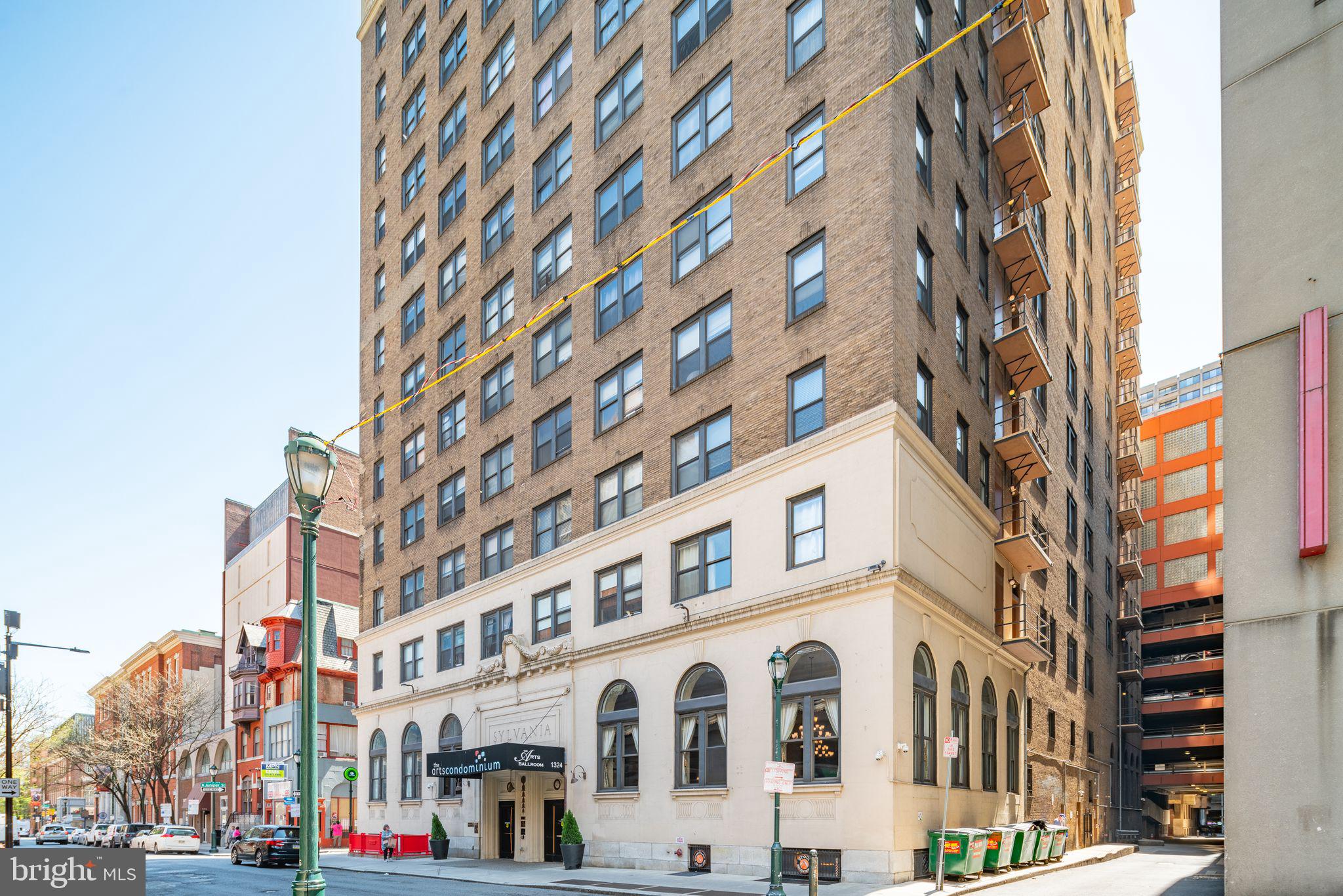 Invest or own a piece of Center City's beating heart! Your monthly HOA covers Electric, Heat/Air Water, basic CABLE TV with HBO, and amenities! This Studio, nestled in a corner unit, boasts 4 expansive windows, lofty ceilings, laminate flooring, and central air. Its kitchenette comes complete with a built-in Microwave, 2-top burner, and mini-fridge. Enjoy the convenience of a 3-piece tiled bathroom with a tub and ample natural light.
Welcome to Arts Condo, a pet-friendly, 16-story high-rise in the heart of Center City. Secured access entry with wheelchair accessibility ensures peace of mind. Step into the grand, historically rich lobby adorned with original marble flooring and soaring ceilings, where a welcoming 24-hour Concierge awaits. Amenities include a surveillance system, a 24-hour Fitness Center, Community Room, and Business Center. On-site laundry facilities, operated via card and mobile app, offer convenience. Additionally, enjoy 24-hour emergency maintenance and bike storage for a nominal yearly fee.
Arts Condo is home to The Arts Ballroom, a beautifully restored 1920s catering hall, and a barber shop. Positioned between the trendy Midtown Village and the famed Avenue of the Arts (housing City Hall, Kimmel Center, and Academy of Music), you're at the epicenter of culture and entertainment. Explore fine dining, upscale shopping, lush parks, theaters, UARTS, Jefferson Hospital and University, Drexel Med, all within walking distance. With various public transportation options and parking nearby, everything is within easy reach at The Arts Condo!