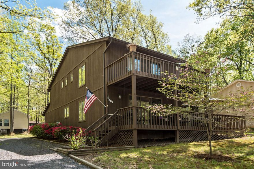 Location is key! Launch your canoe or walk to the beach from this stunning contemporary. Spacious open floor plan inside, and deck and balcony outside to take in all the views. You will love the Lake of the Woods lifestyle: swim from the beach, take a dip in the pool, play a round of golf, trail ride from the stables, enjoy a meal at the clubhouse overlooking the pristine lake, and so much more!